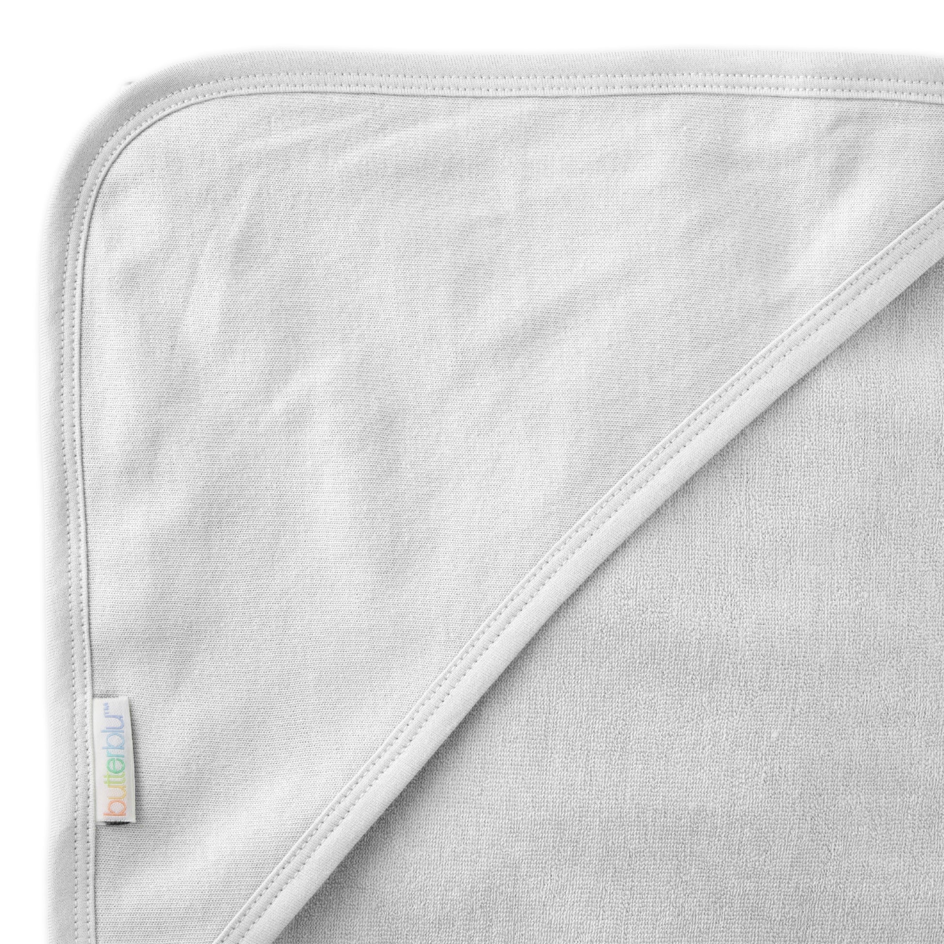Close up of hood on towel with butterblu tag on towel