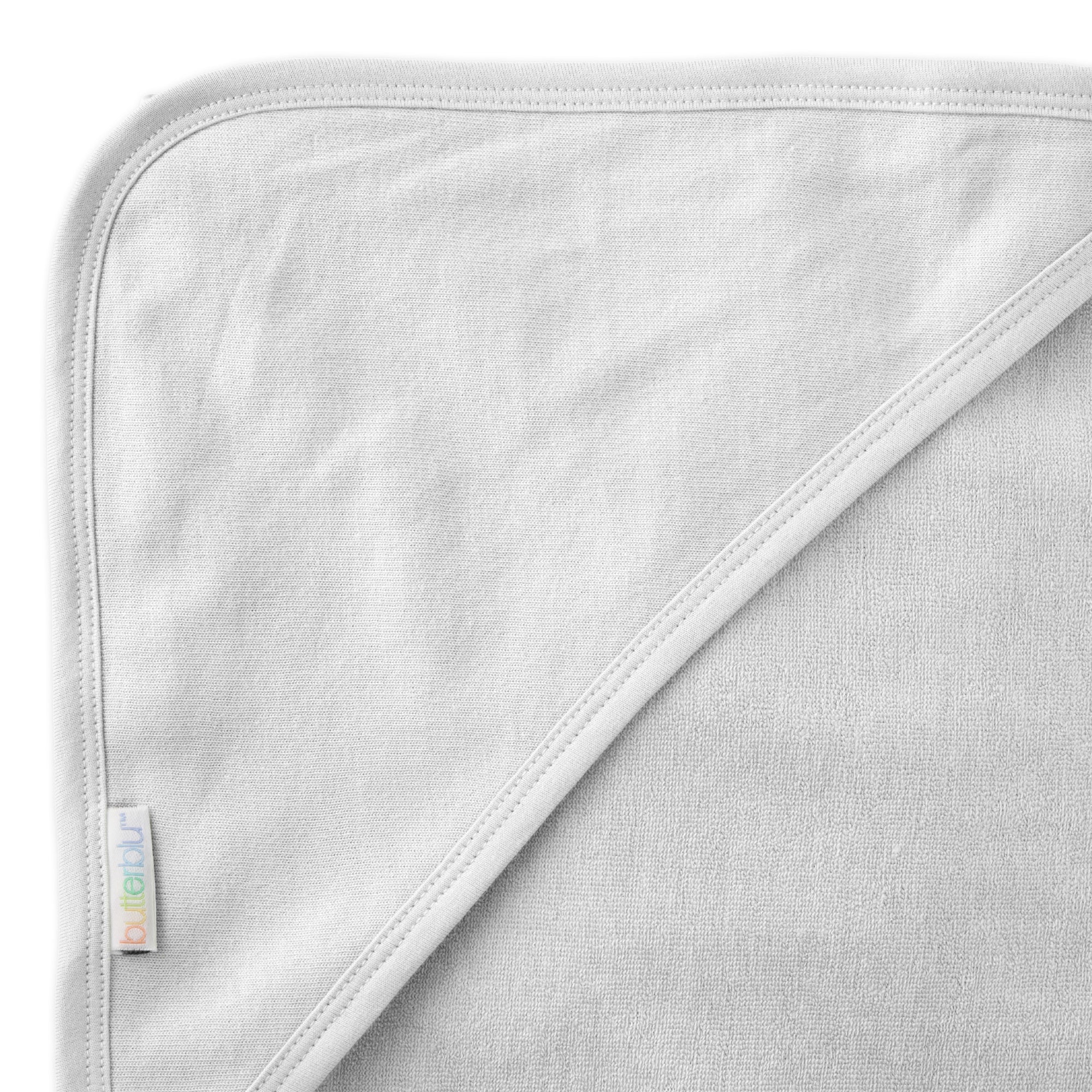 Close up of hood on towel with butterblu tag on towel