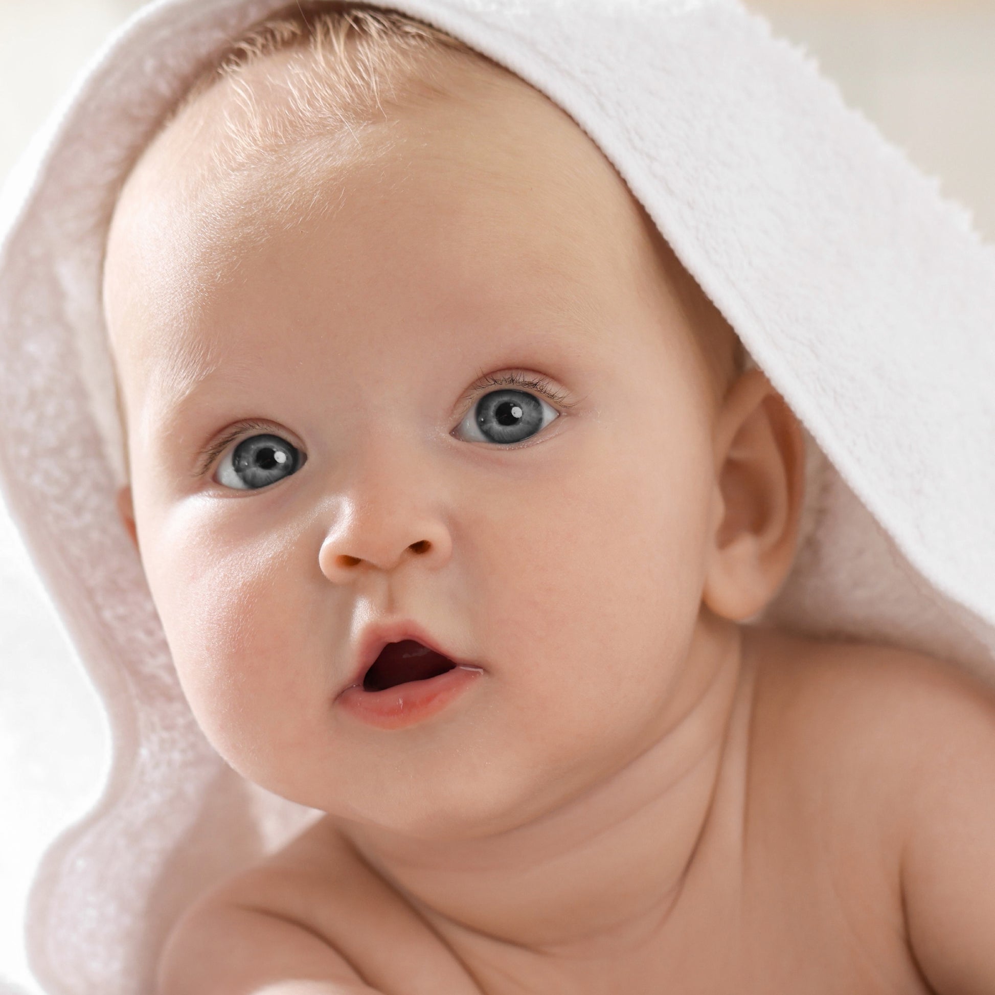 Baby wearing hooded towel