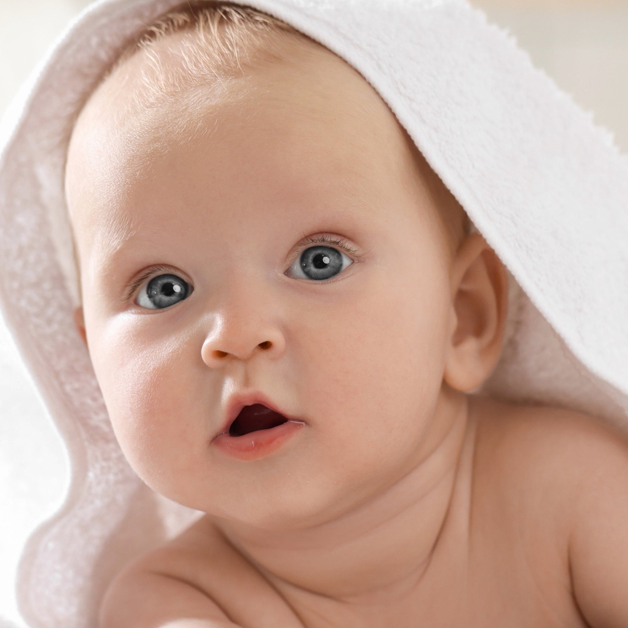 Baby wearing hooded towel