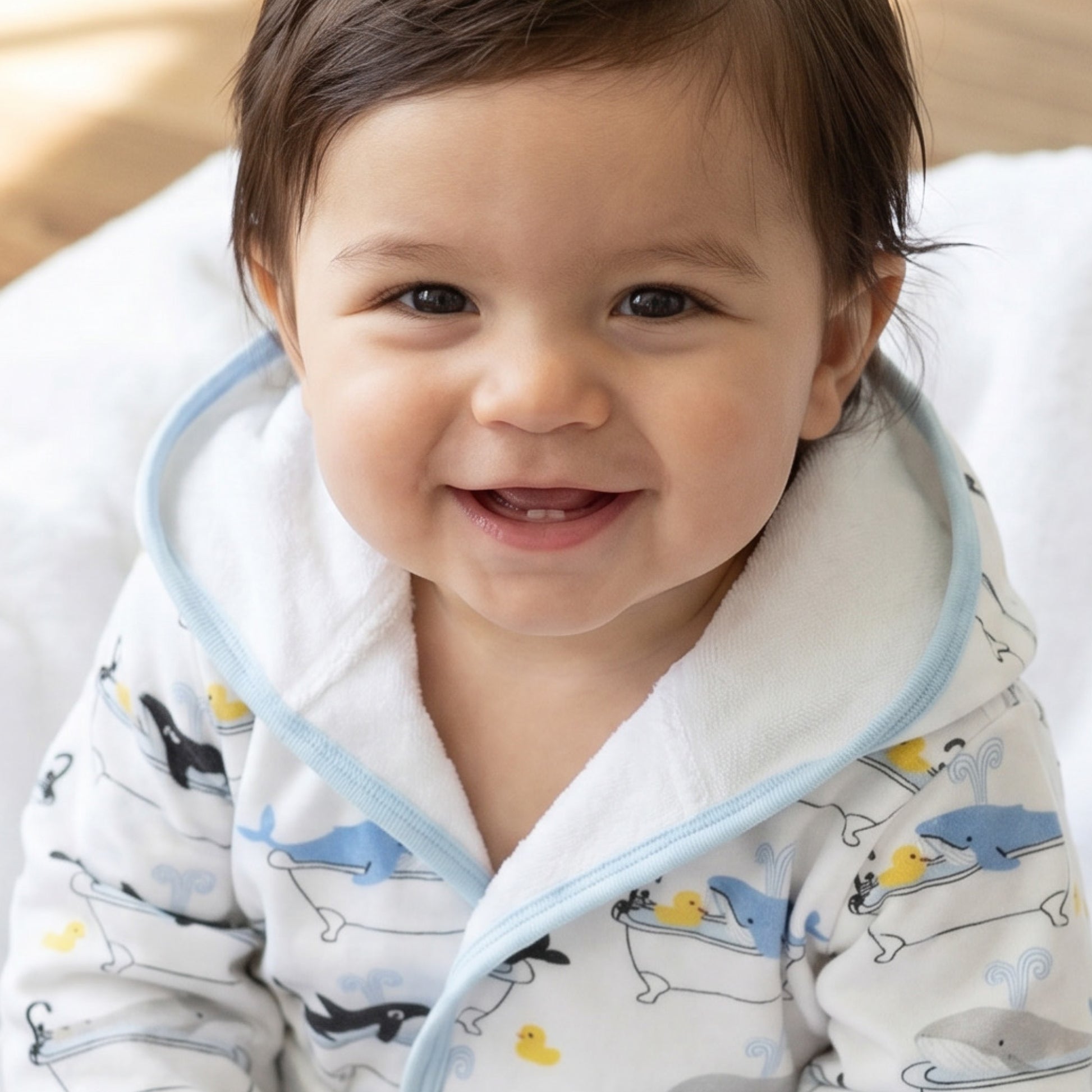 Really cute baby wearing Oh Whale Robe