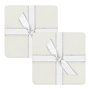 Two square coasters with white stitching and a bow on a white background