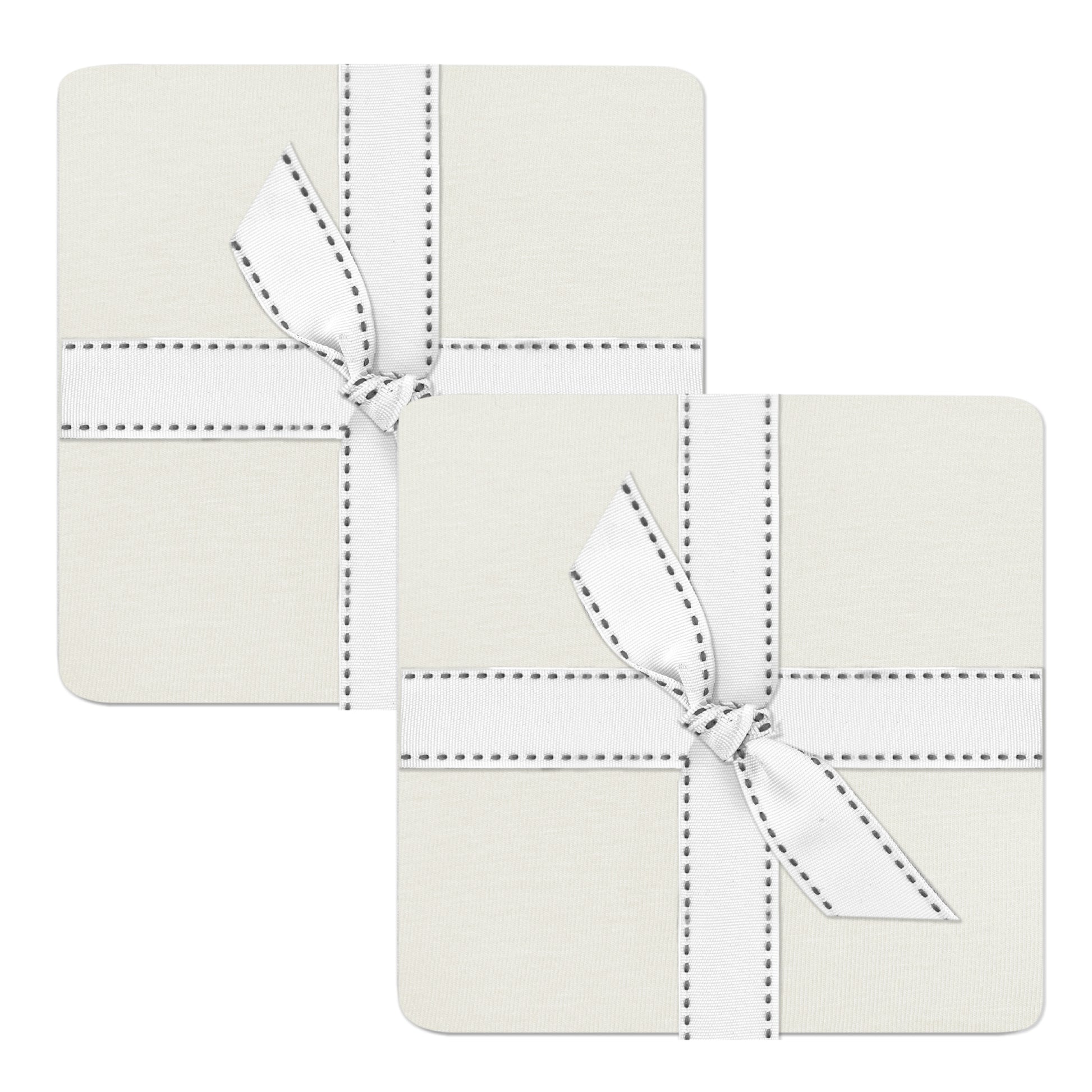 Two square coasters with white stitching and a bow on a white background