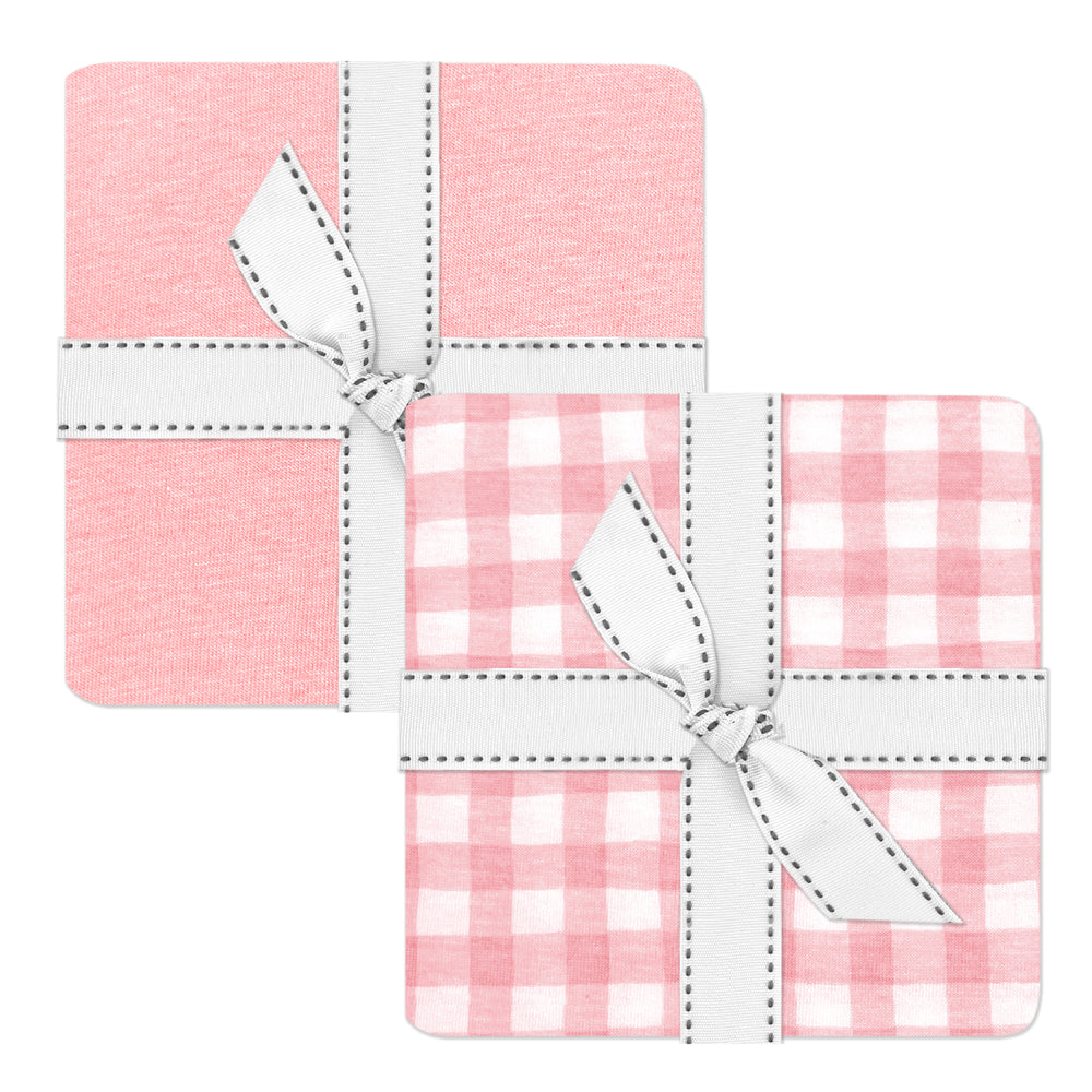 Set of three pink and white checkered coasters with white bows on a white background