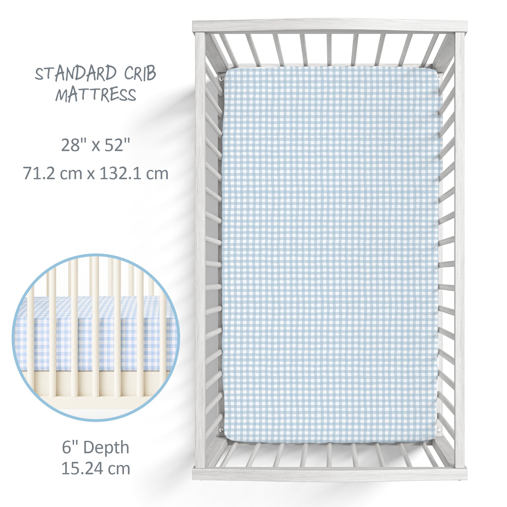Baby crib with a fitted sheet on a white background, showing dimensions.