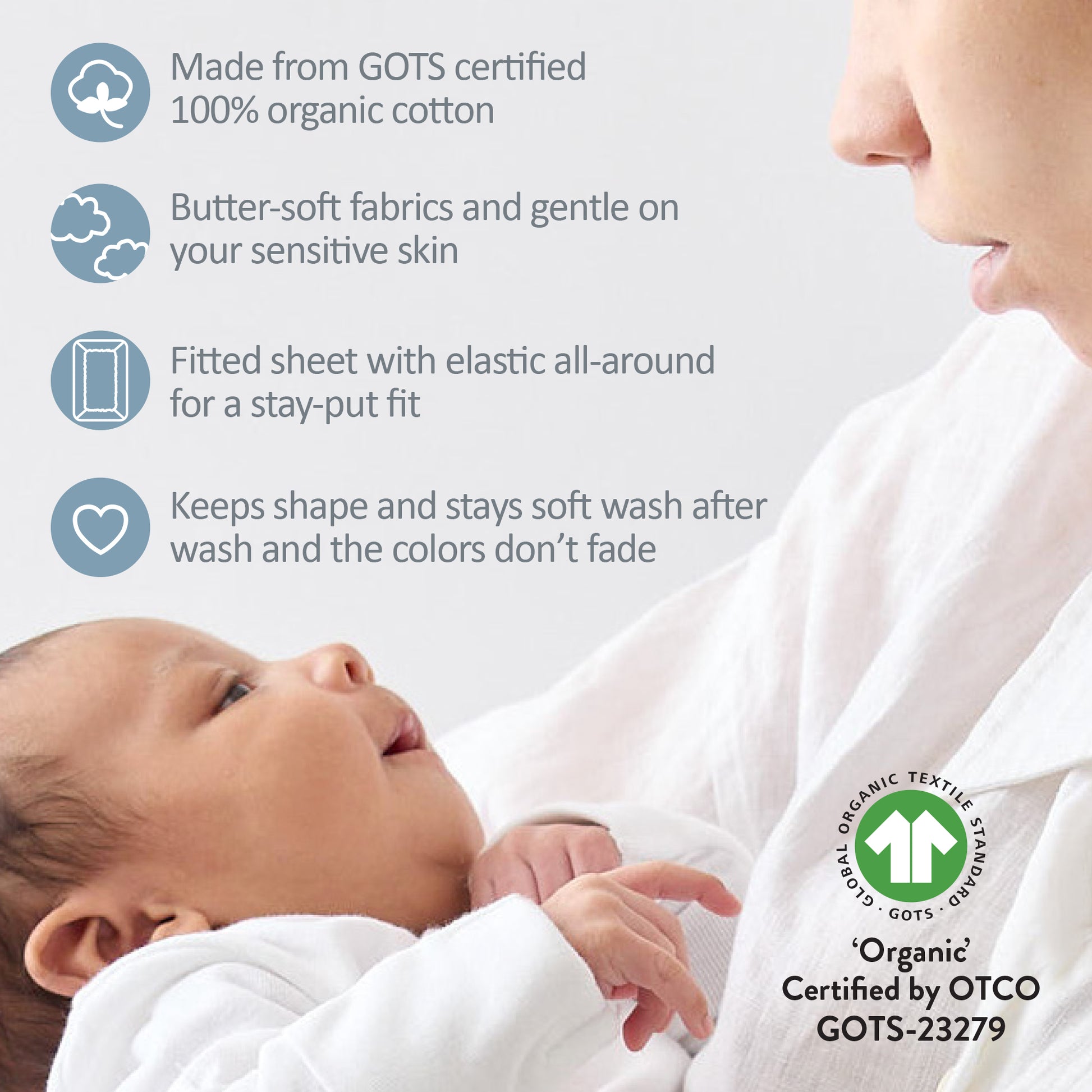 Baby wrapped in a white blanket with GOTS certification logo and text about organic cotton.