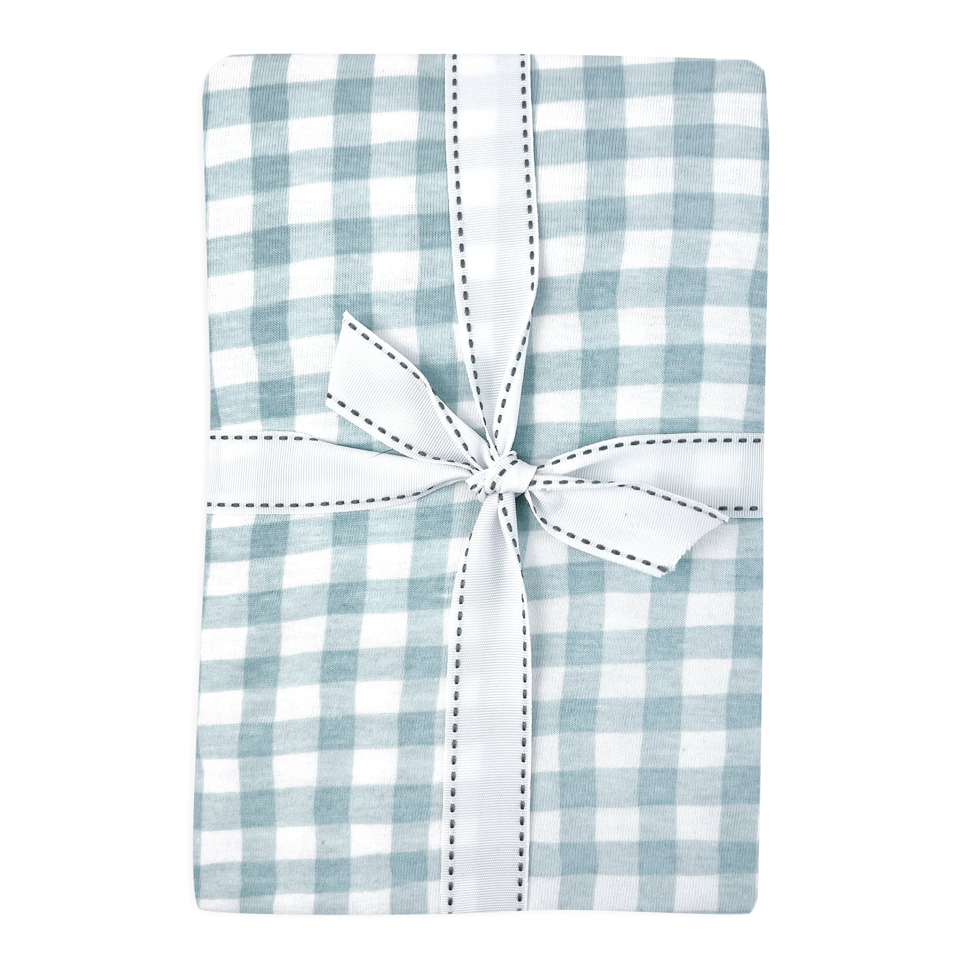 Blue and white checkered baby crib sheet with a white bow on a white background