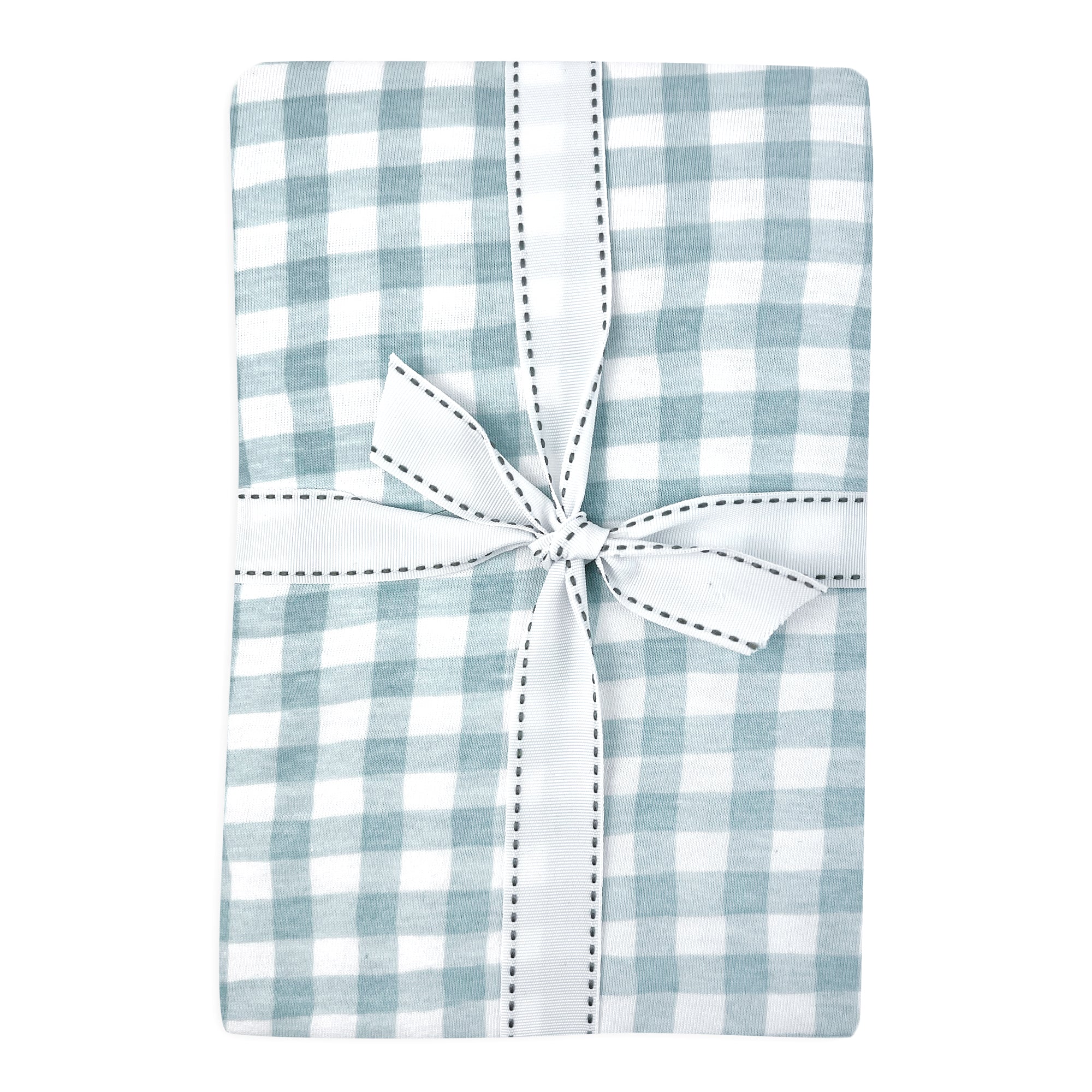 Blue and white checkered baby crib sheet with a white bow on a white background