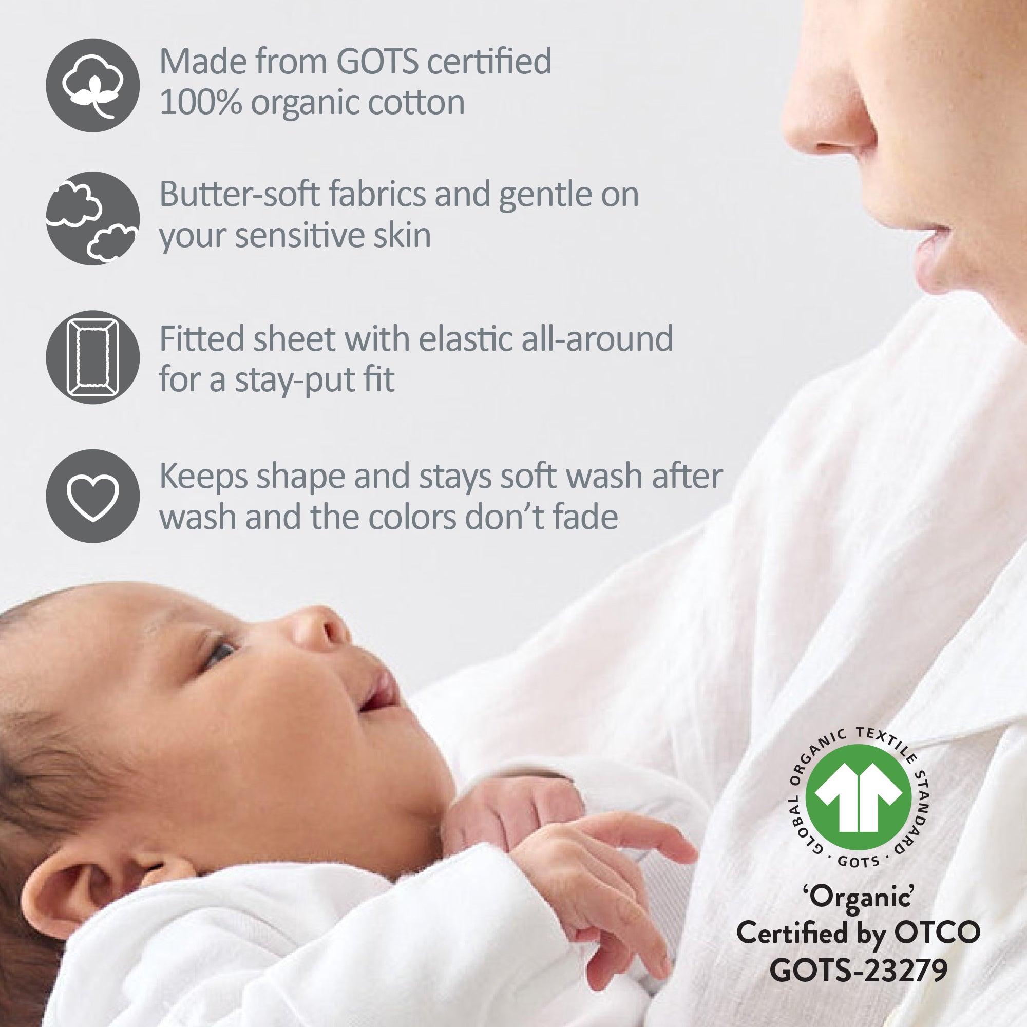 Baby wrapped in organic cotton fabric with GOTS certification label
