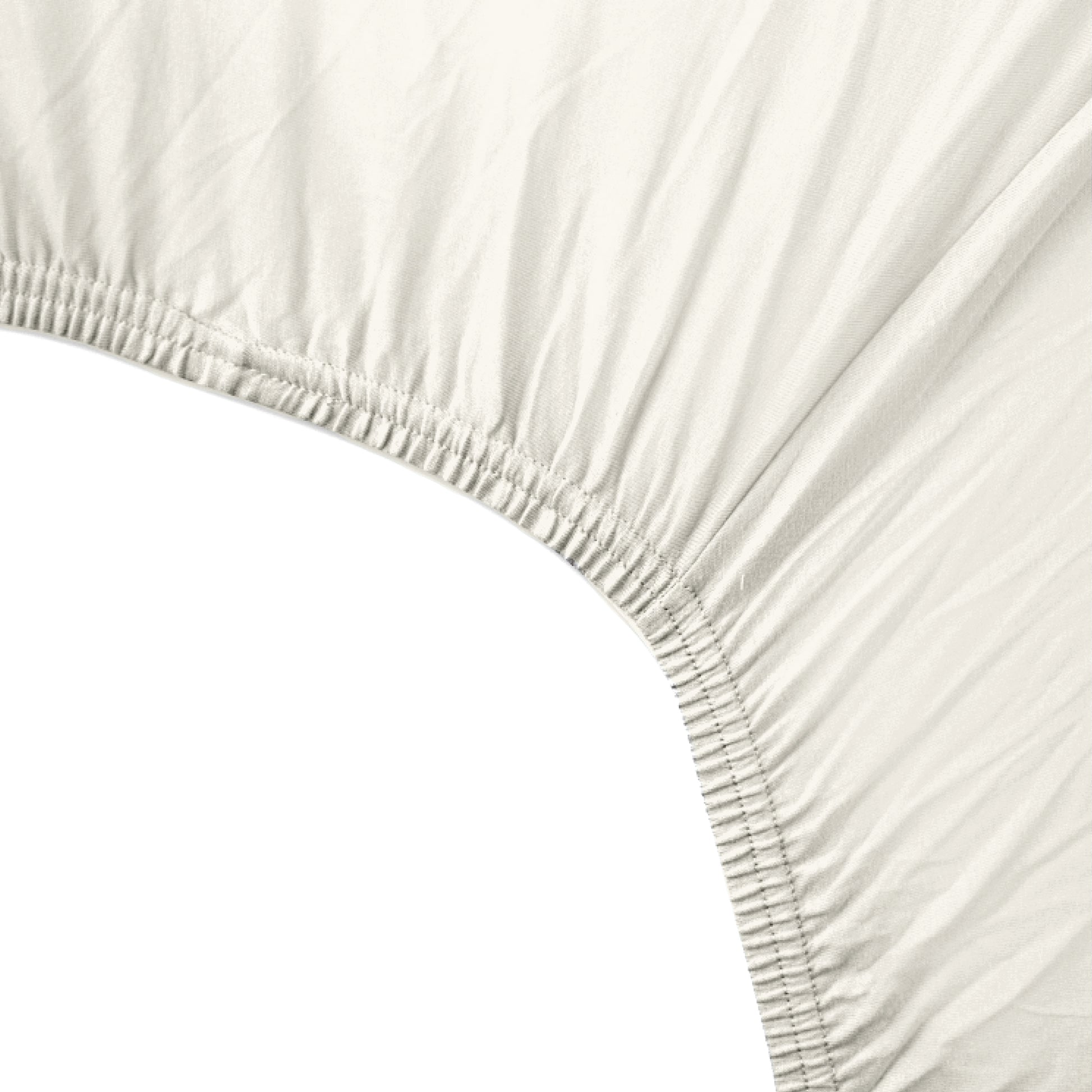Close-up of a fitted sheet with elastic edge on a white background
