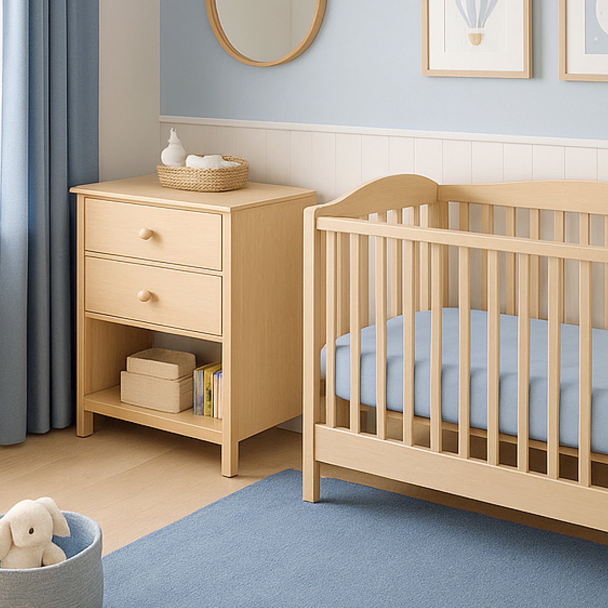 Nursery room with wooden crib and side table against a light blue wall.
