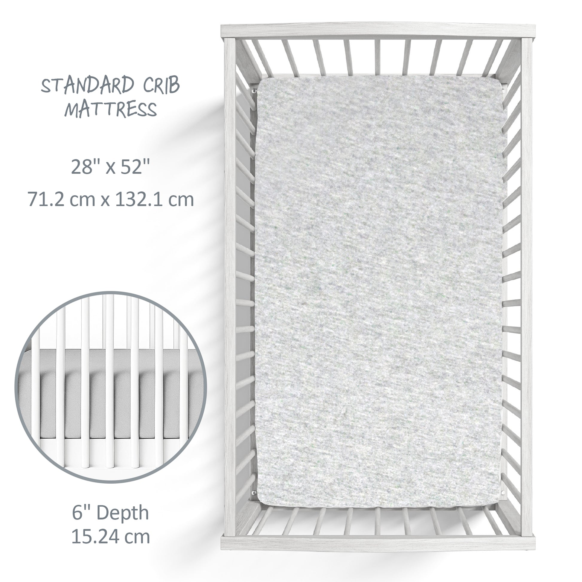 Gray crib mattress on a white crib with dimensions displayed