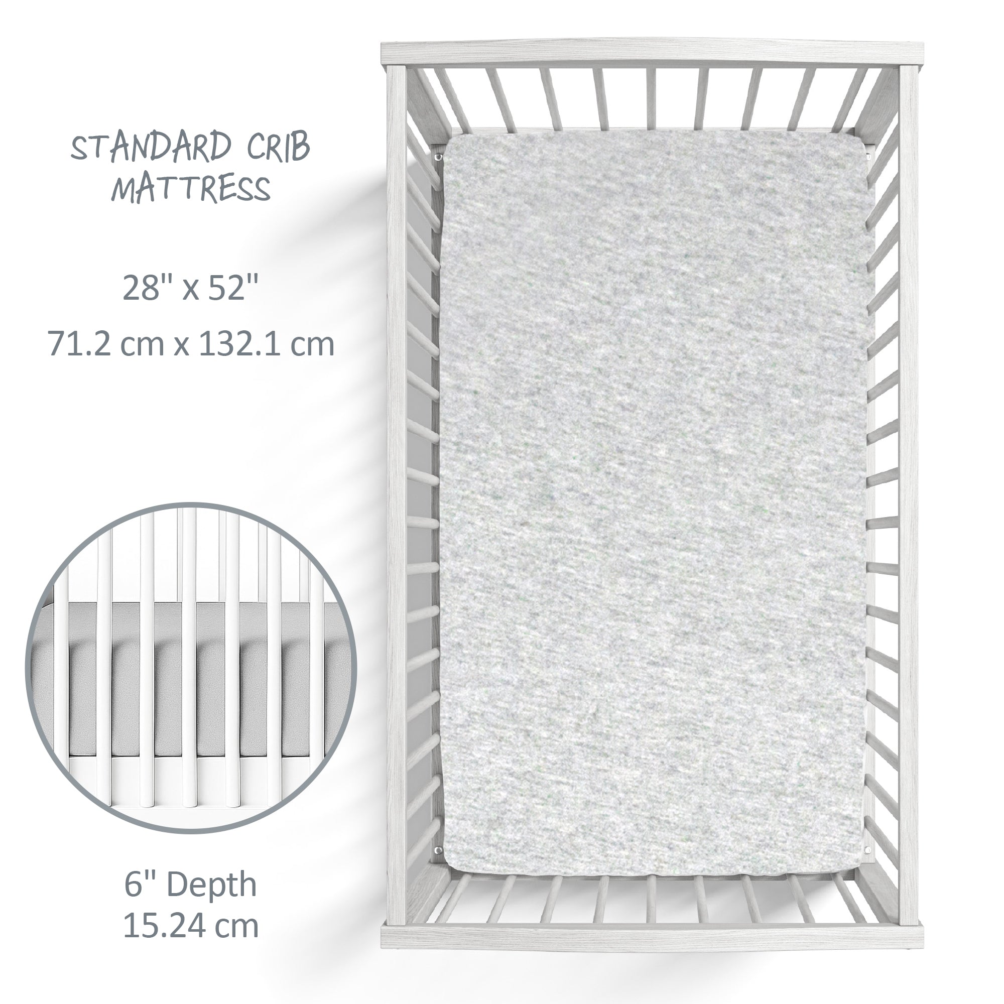 Gray crib mattress on a white crib with dimensions displayed