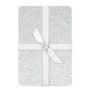 Gray fabric square with a white bow on a white background