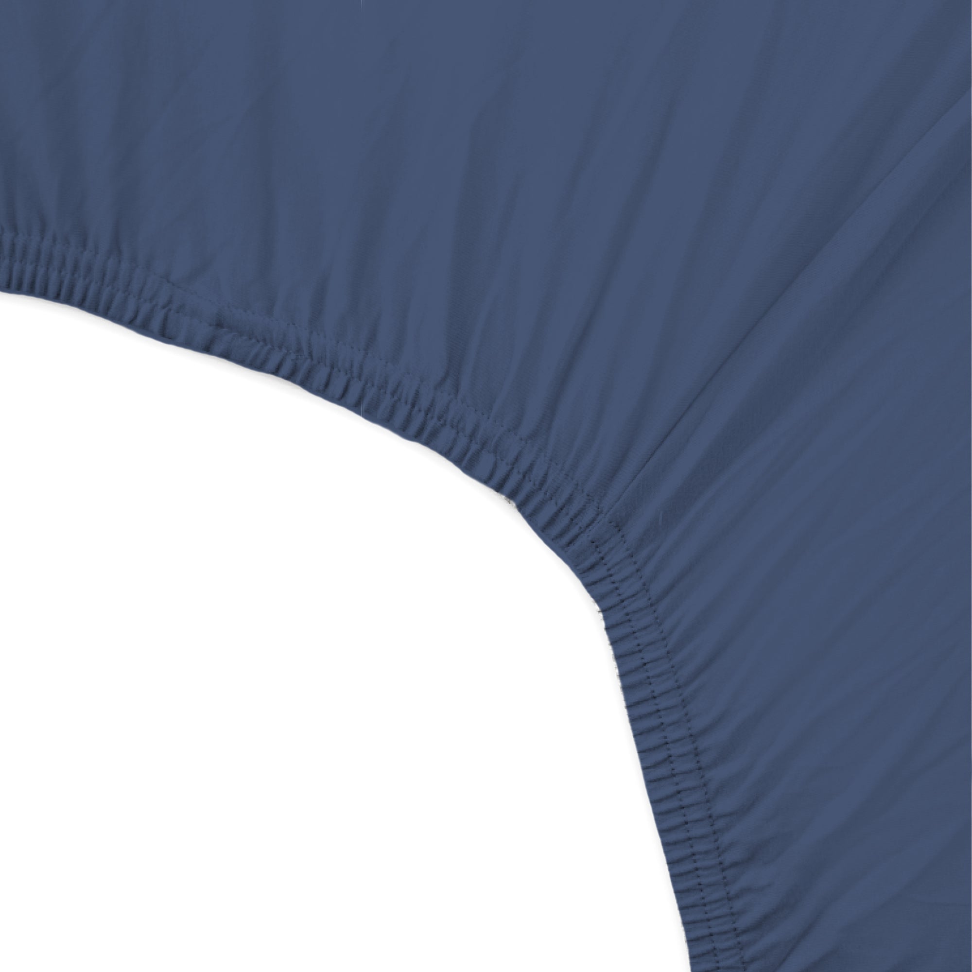Close-up of a blue fitted sheet corner on a white background
