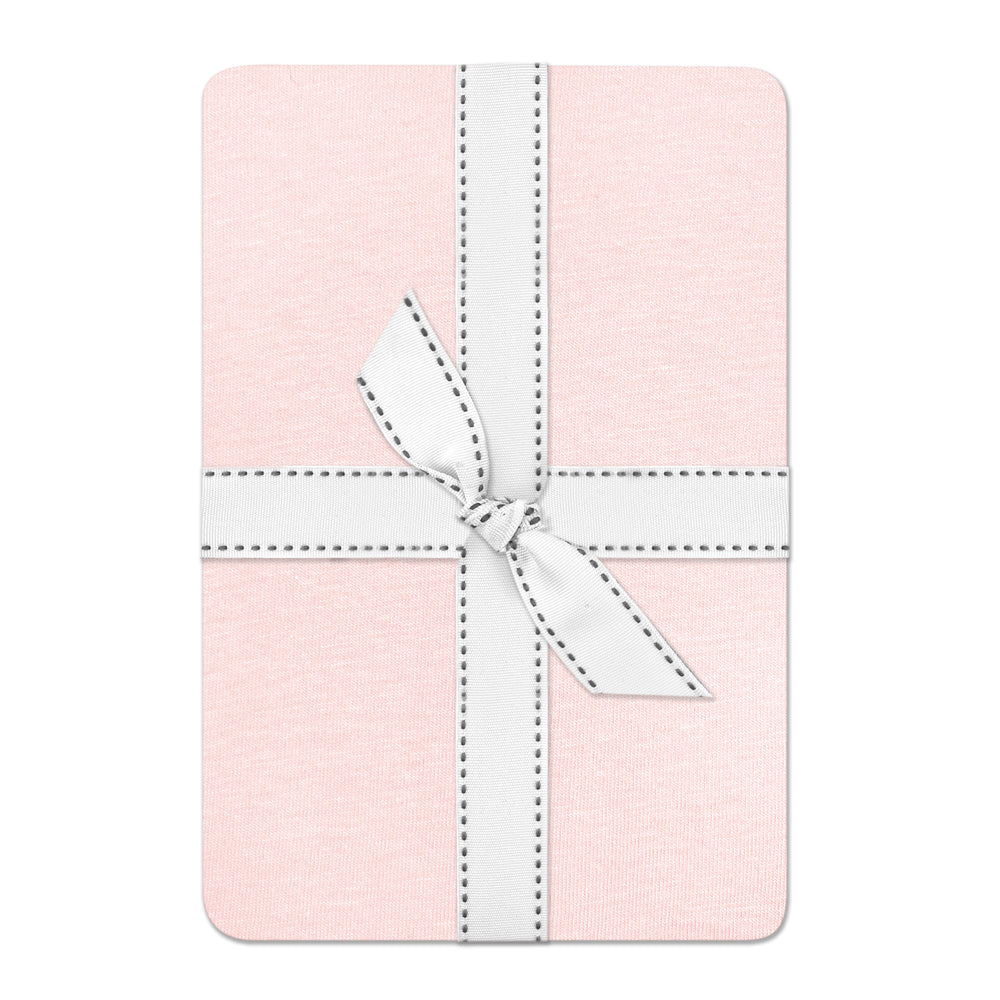 Pink fabric with a white ribbon on a white background