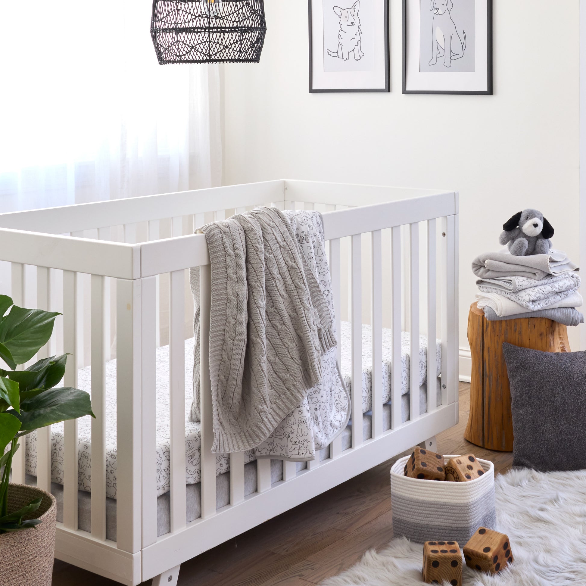 Butterblu Frankie fitted crib sheet in Puppy Party — GOTS-certified organic cotton crib sheet for standard cribs