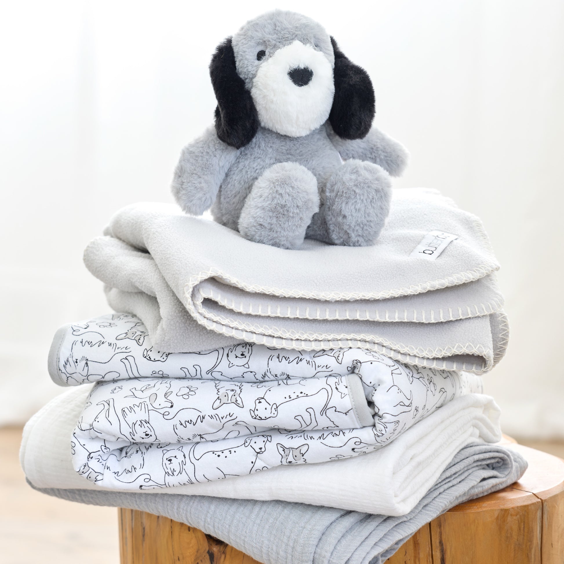 Butterblu Frankie fitted crib sheet in Puppy Party — GOTS-certified organic cotton crib sheet for standard cribs