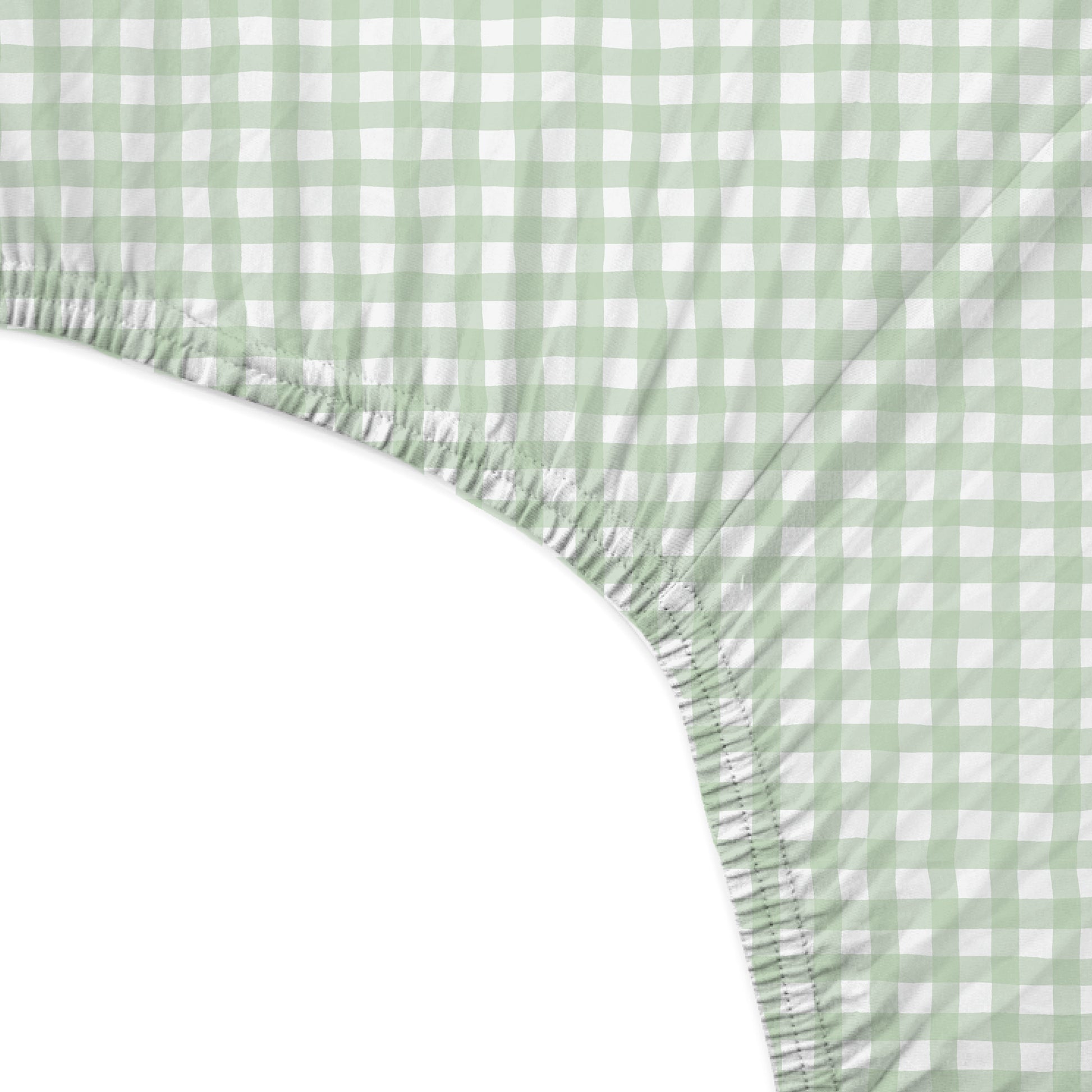 Green and white checkered fitted sheet on a bed