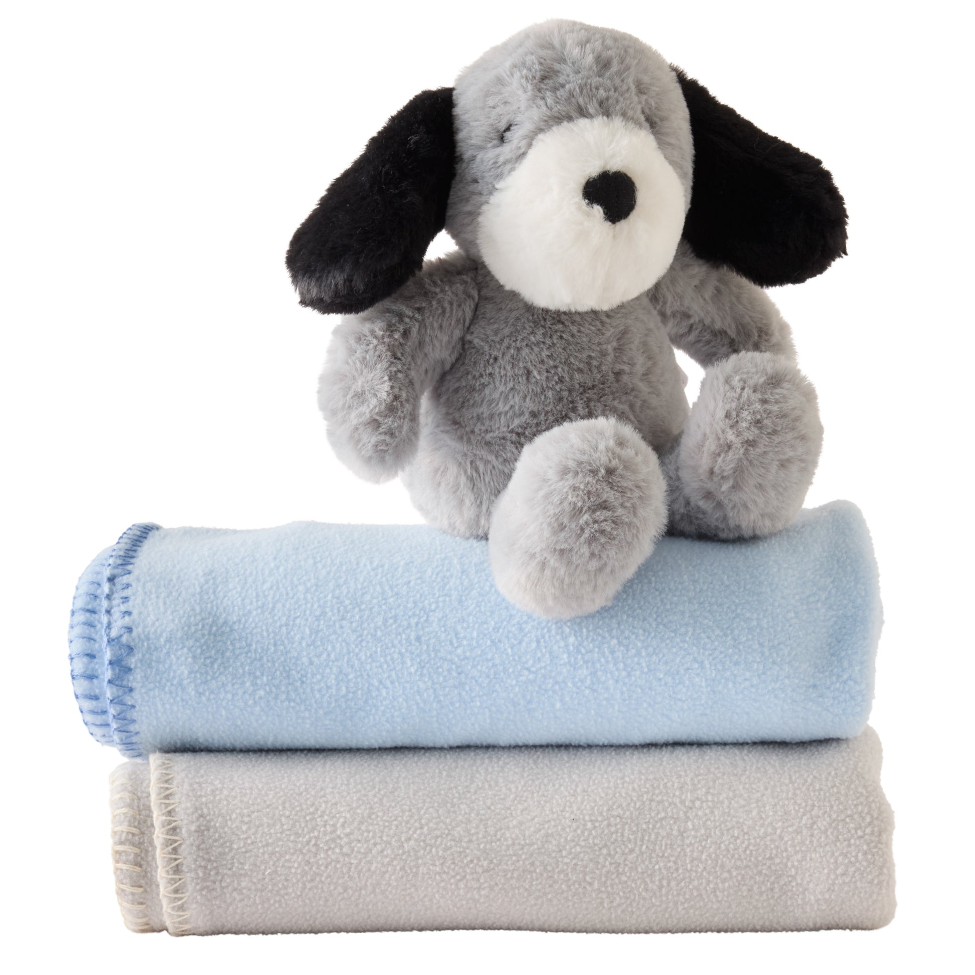 Plush dog toy with a blue blanket and gray folded blanket on a white background