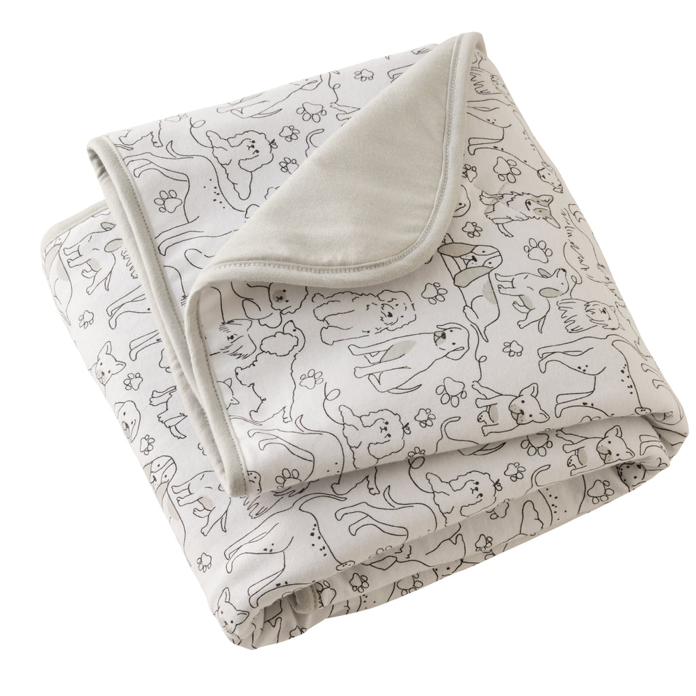 Folded blanket with dog pattern on a white background