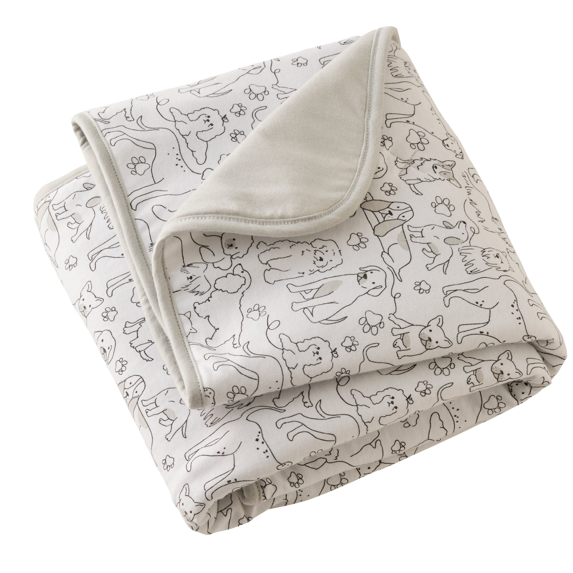 Folded blanket with dog pattern on a white background