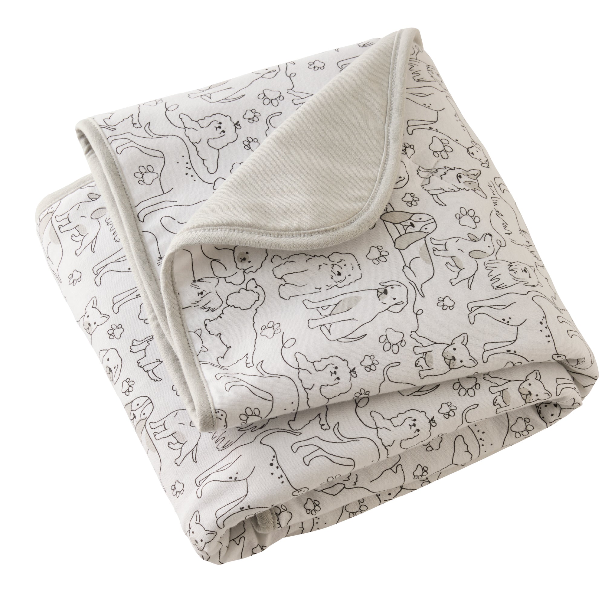 Folded blanket with dog pattern on a white background