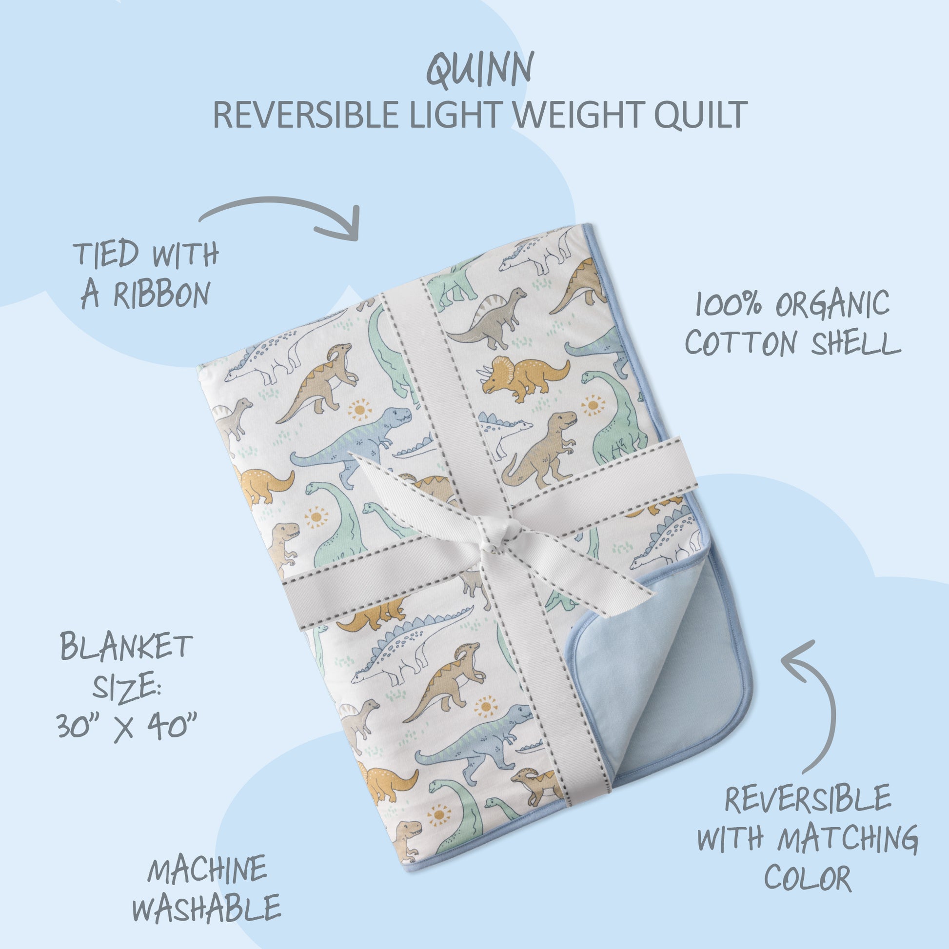 Reversible lightweight quilt with dinosaur pattern on a light blue background