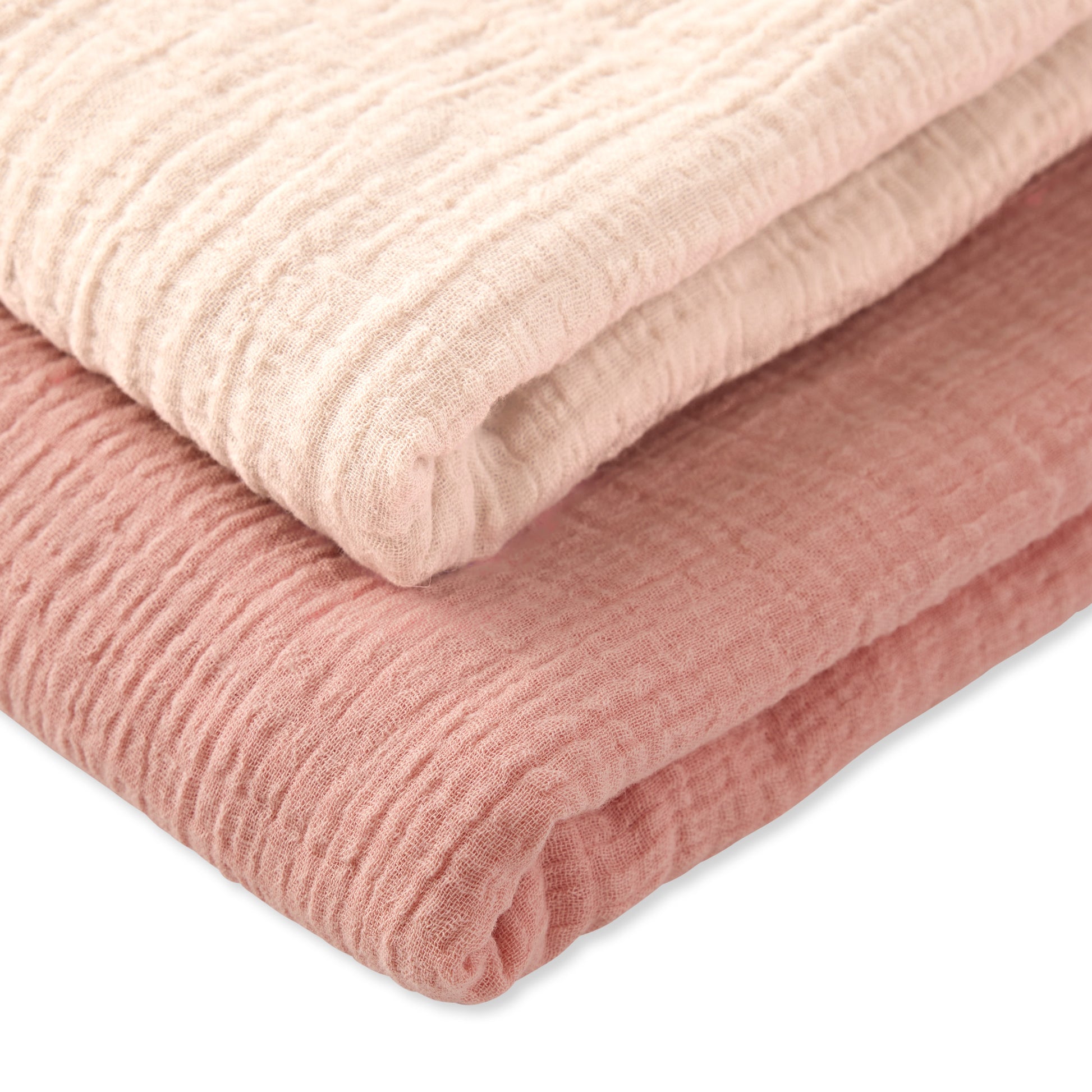 Stack of pink textured fabric on a white background