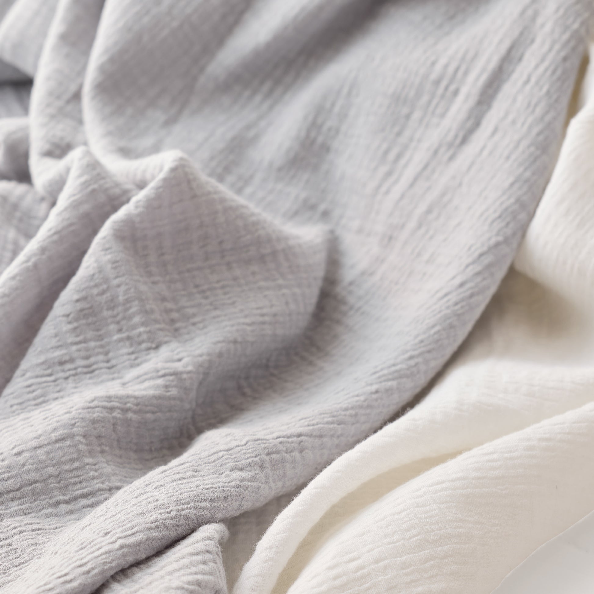 Close-up of soft, textured gray fabric with a slight sheen.