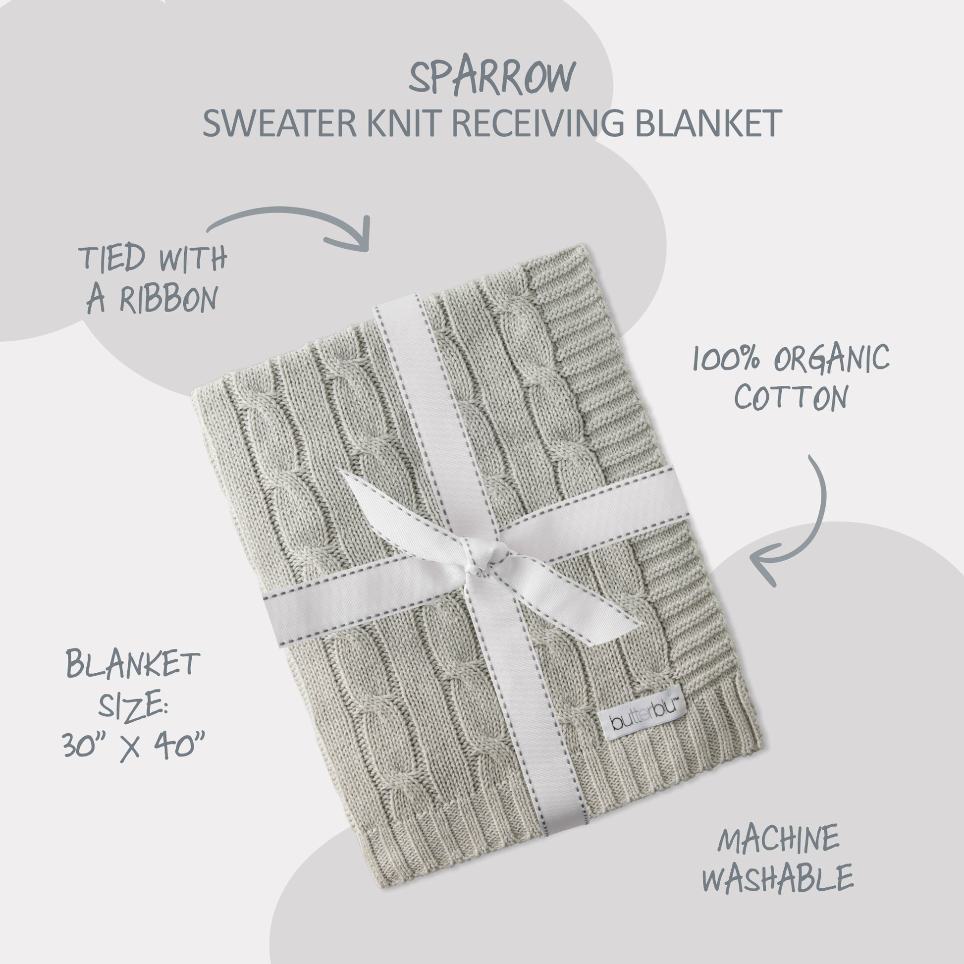 Knitted receiving blanket with a ribbon on a light gray background