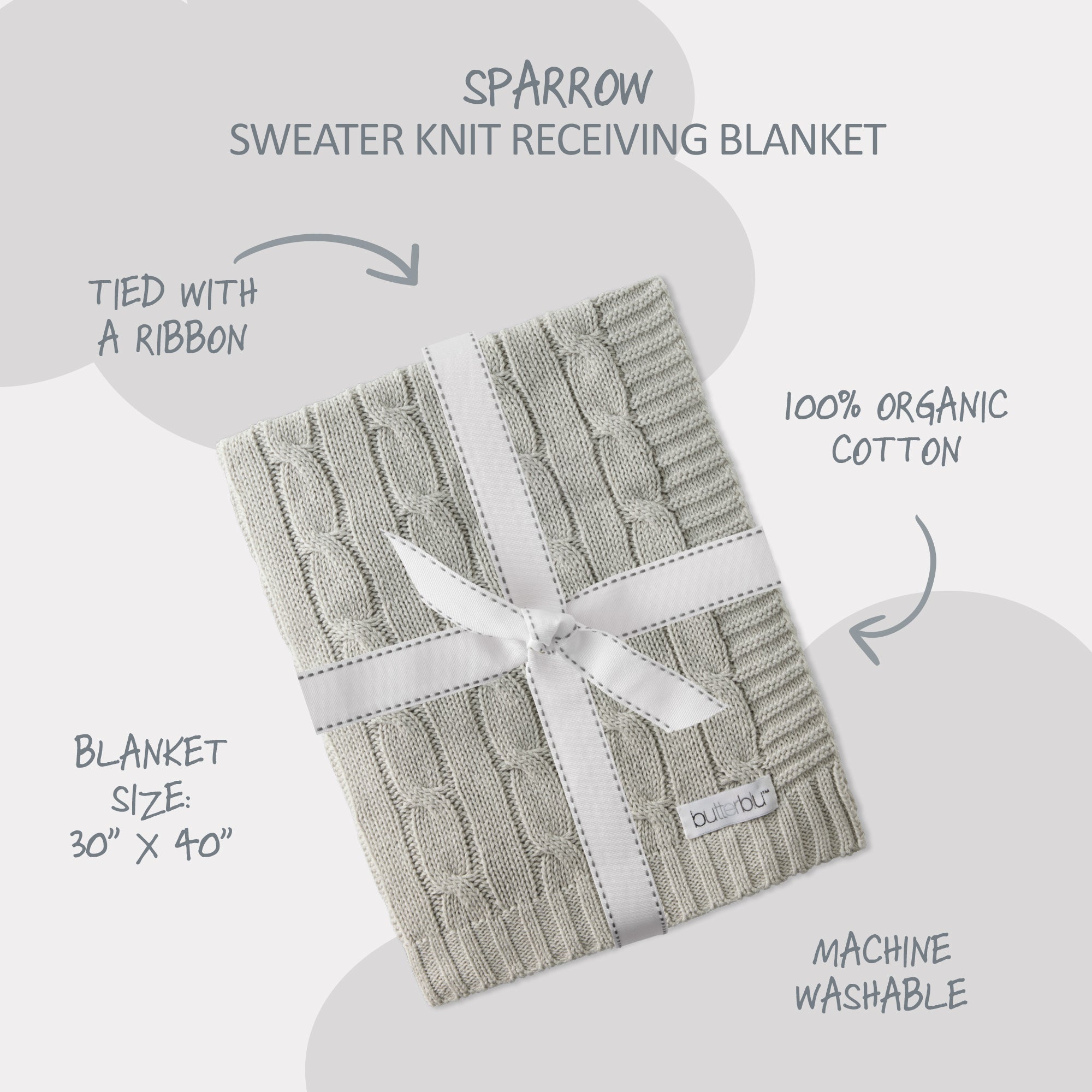 Knitted receiving blanket with a ribbon on a light gray background