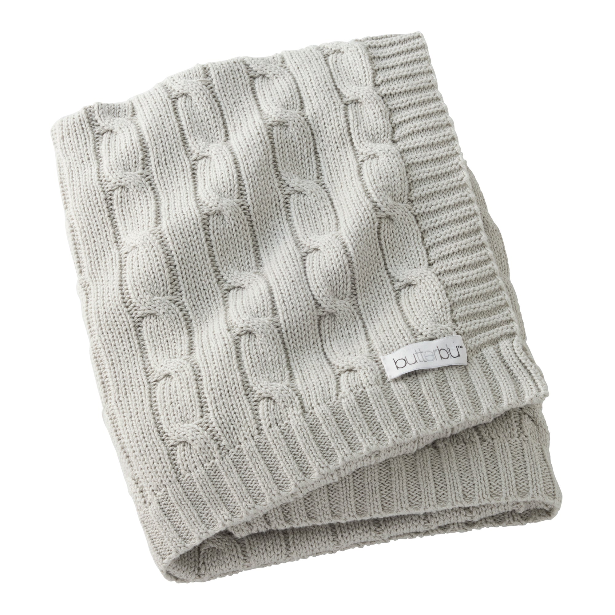 Folded gray knitted blanket with a brand label on a white background