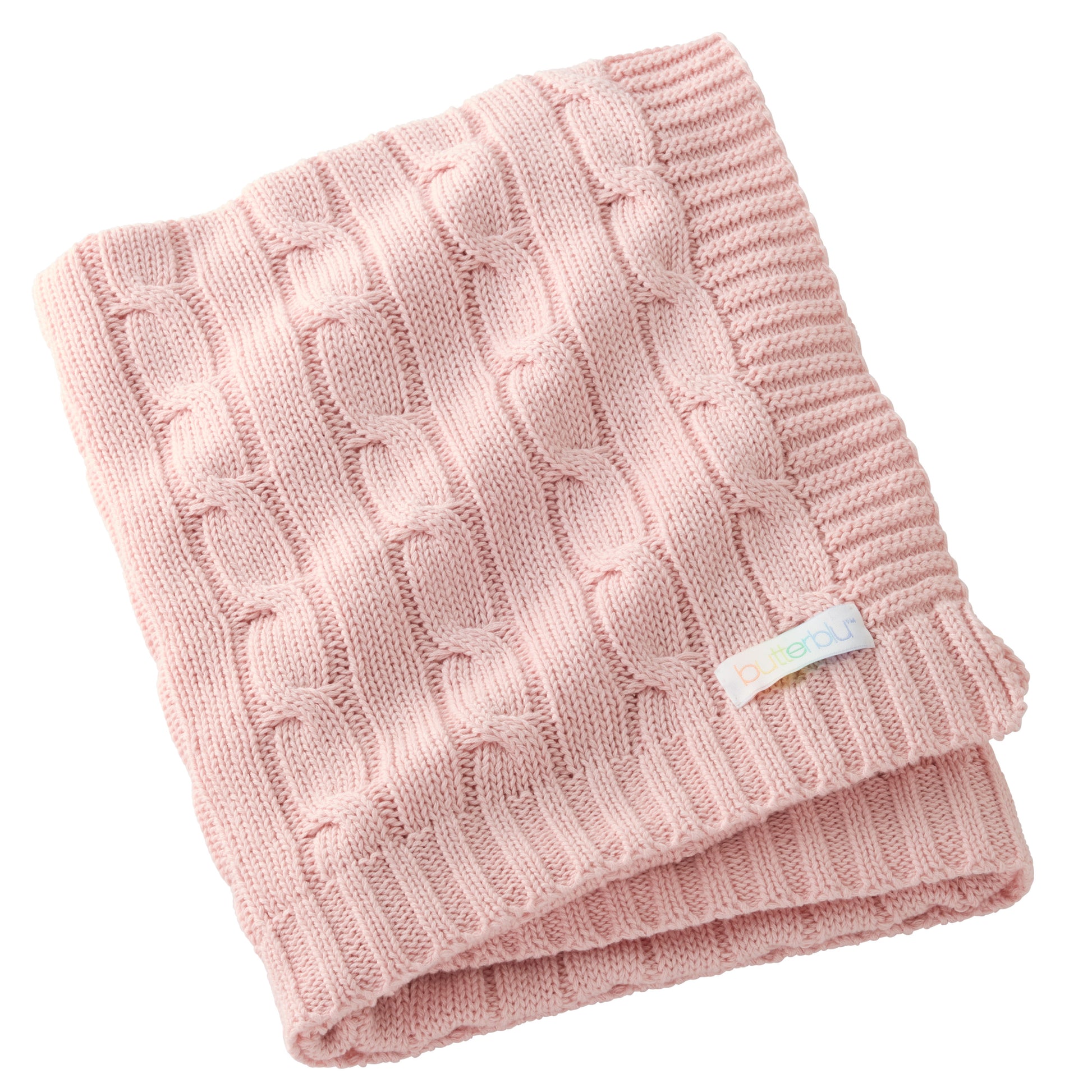 Pink knitted blanket with a visible brand label on a white background