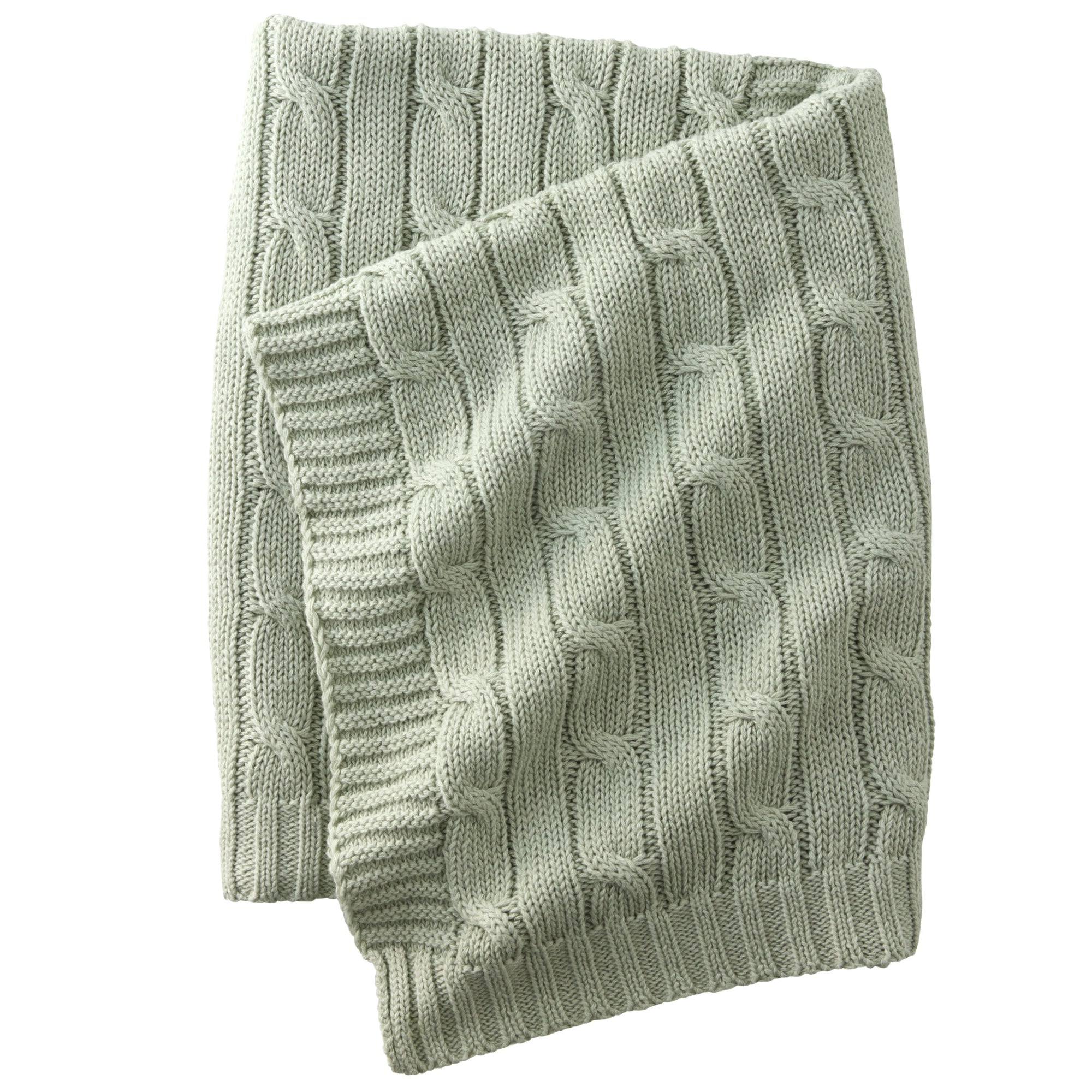 Folded green knitted blanket on a white background