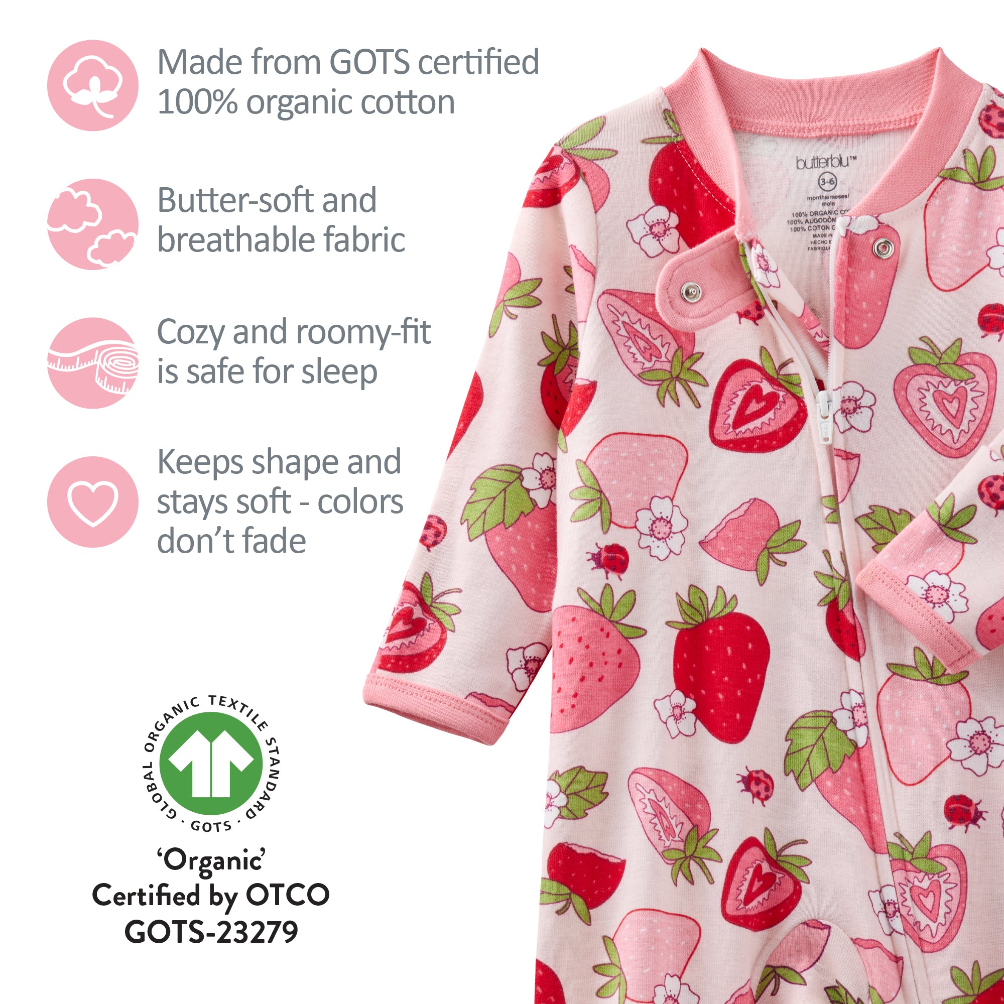 Baby onesie with strawberry pattern and certification details on a white background
