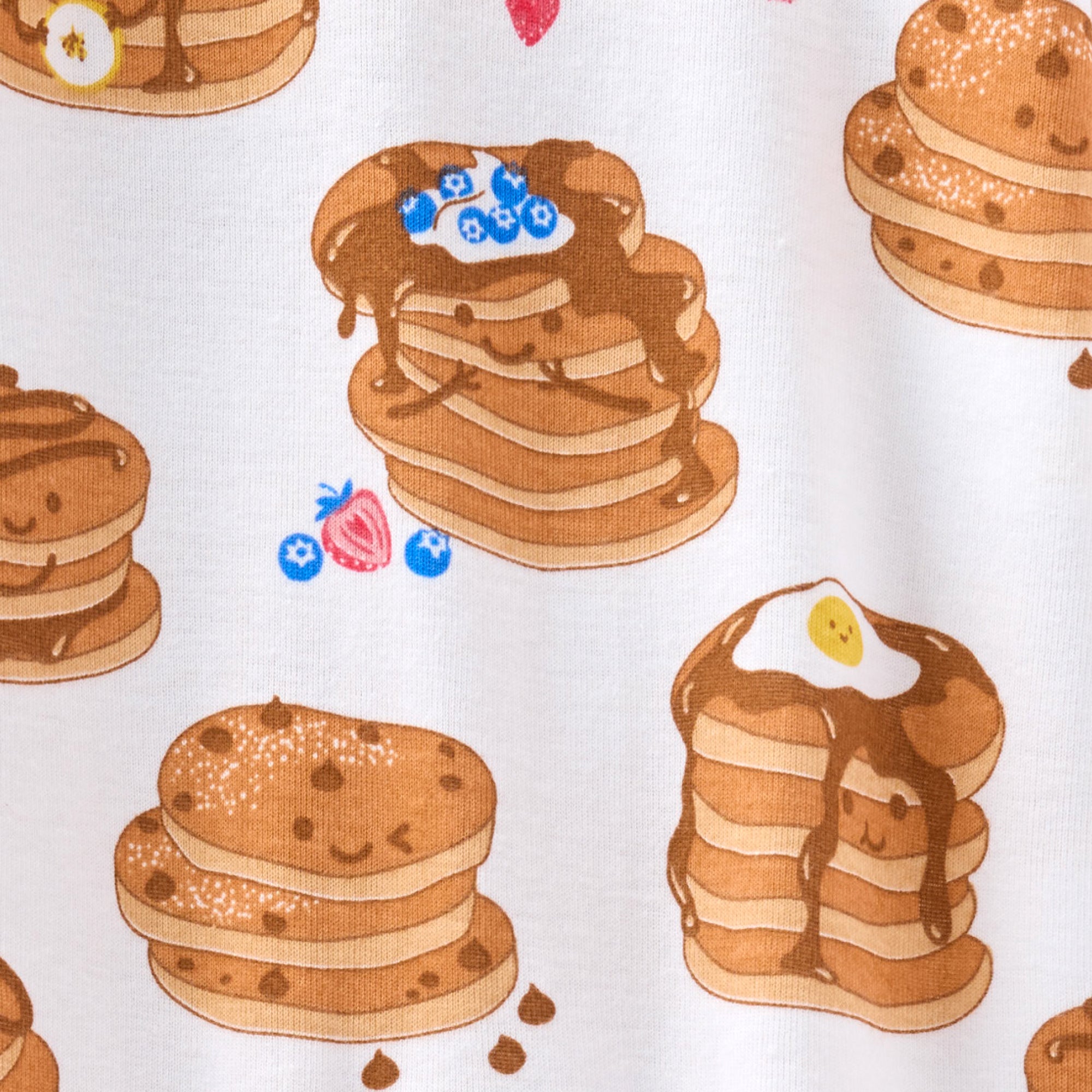 Pattern of cartoon pancakes and waffles on a white background