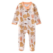 Baby onesie with donut pattern on a white background