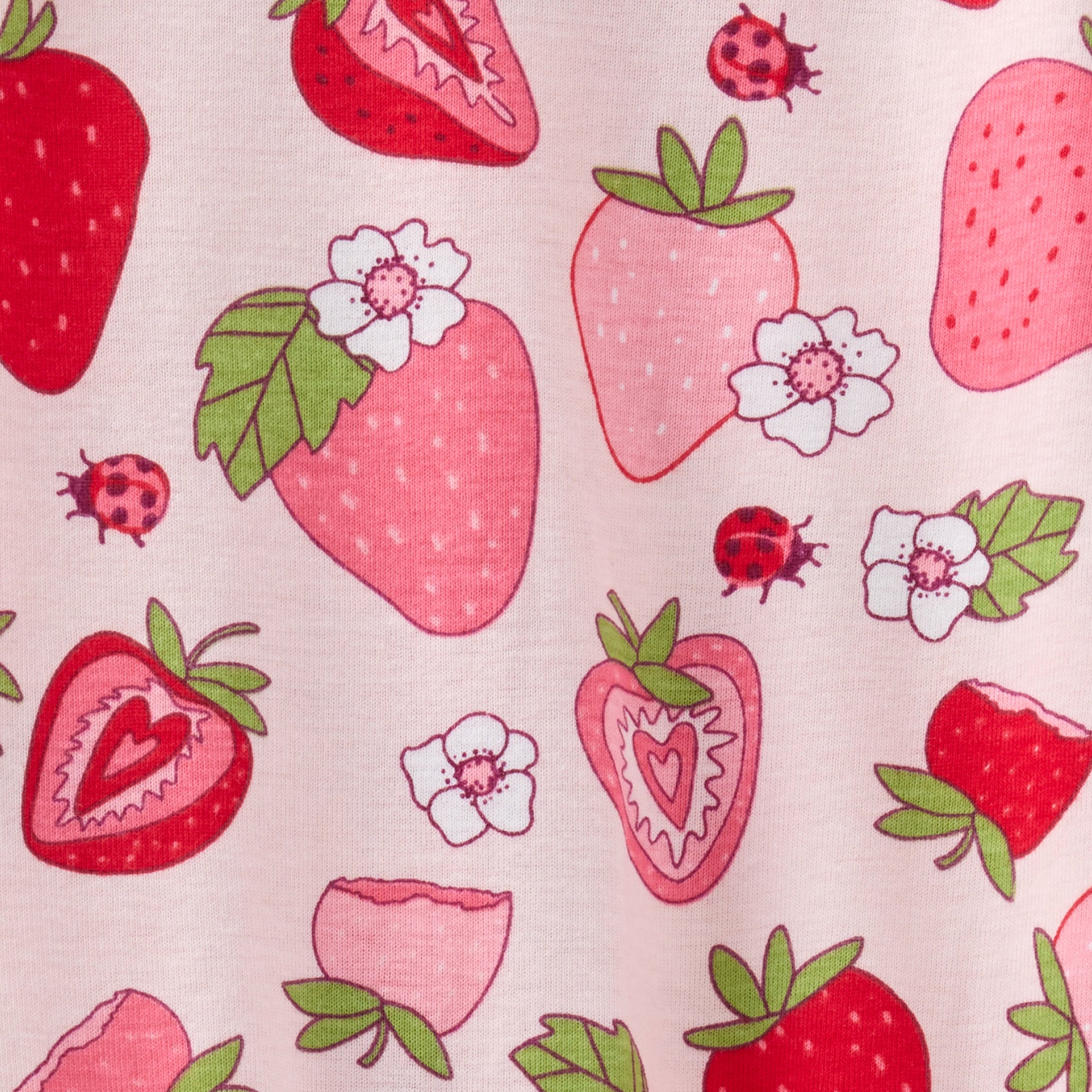 Pattern of strawberries, flowers, and ladybugs on a light pink background