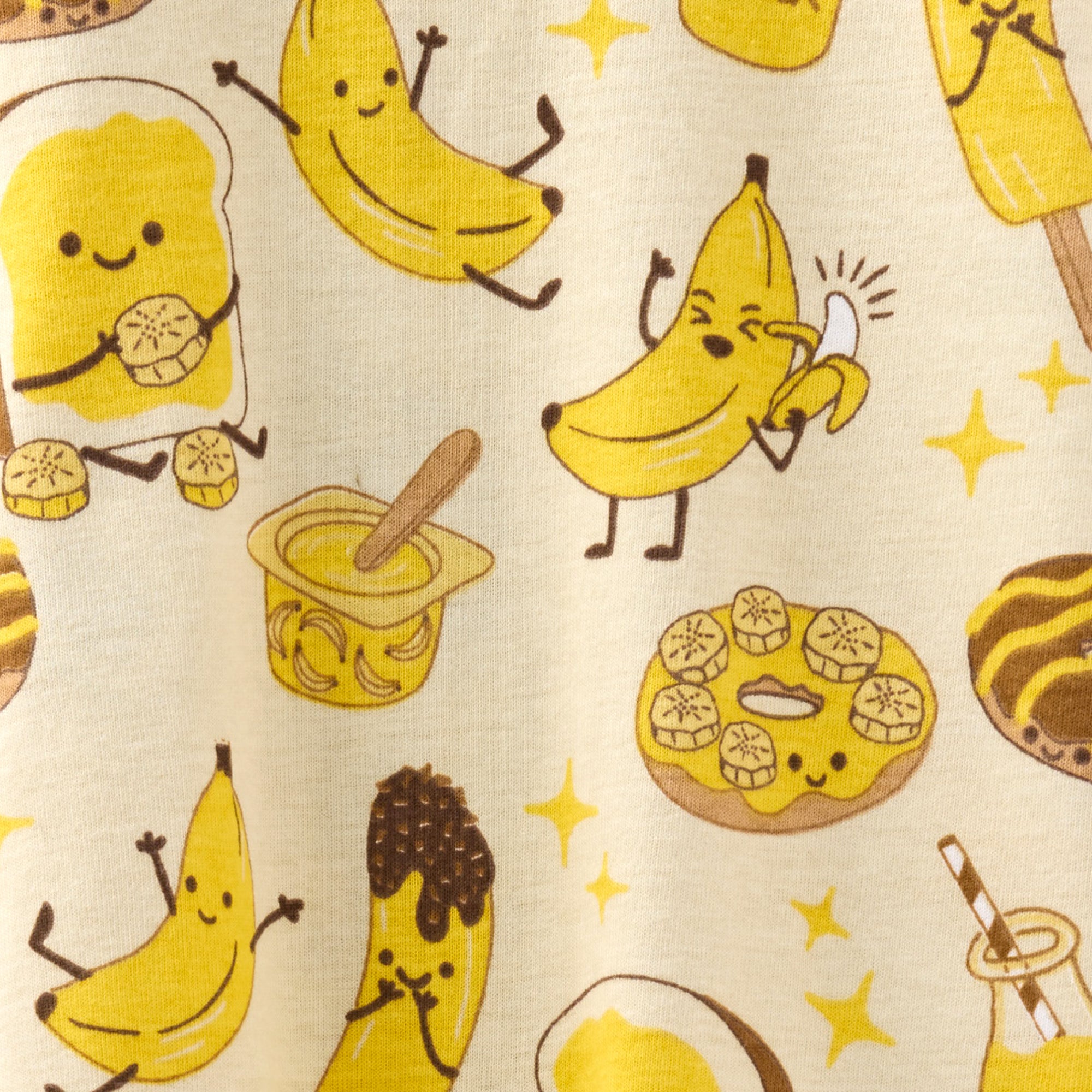 Pattern of cartoon bananas, donuts, and other food items on a beige background