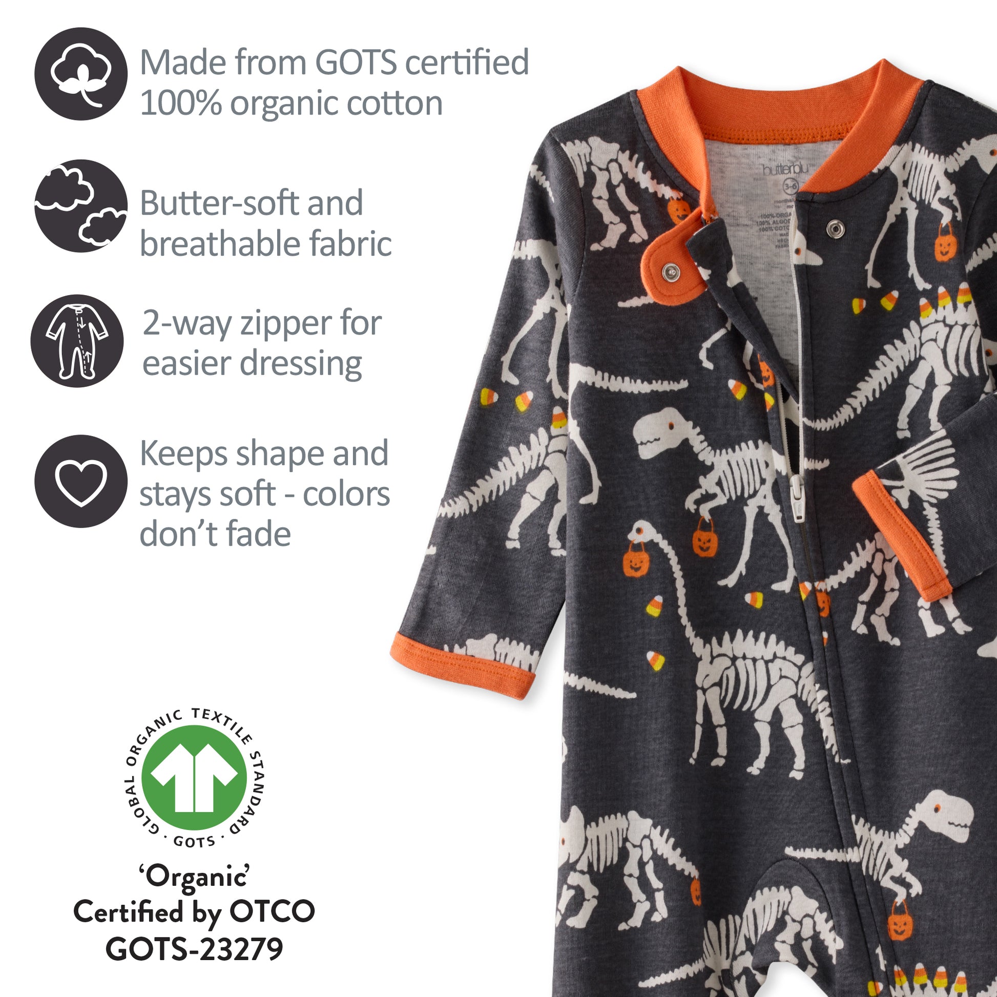 Children's jacket with dinosaur skeleton pattern on a white background, featuring GOTS certification details.