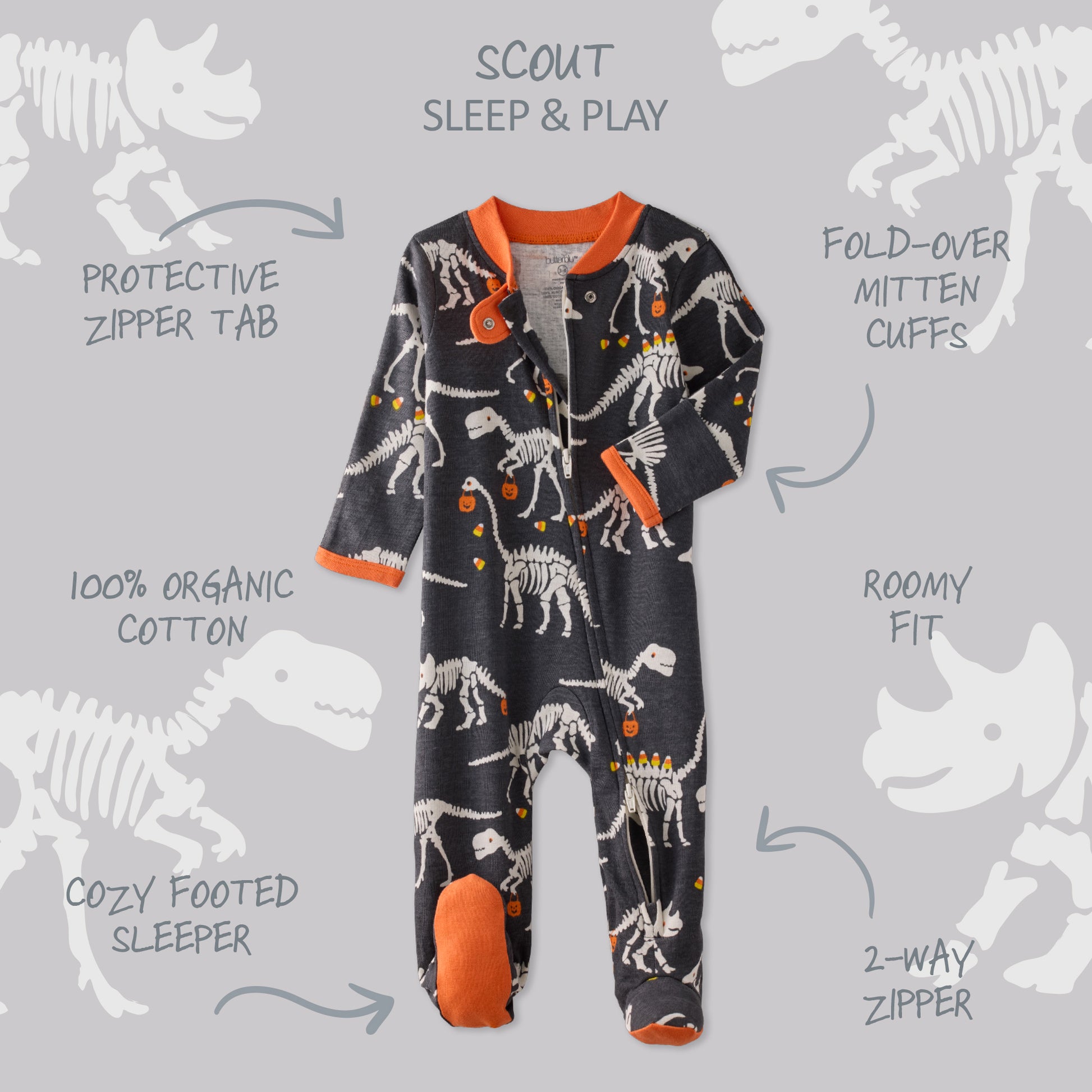 Children's onesie with dinosaur pattern on a gray background with text detailing features.