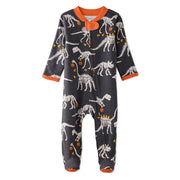Baby onesie with dinosaur skeleton pattern on a white background