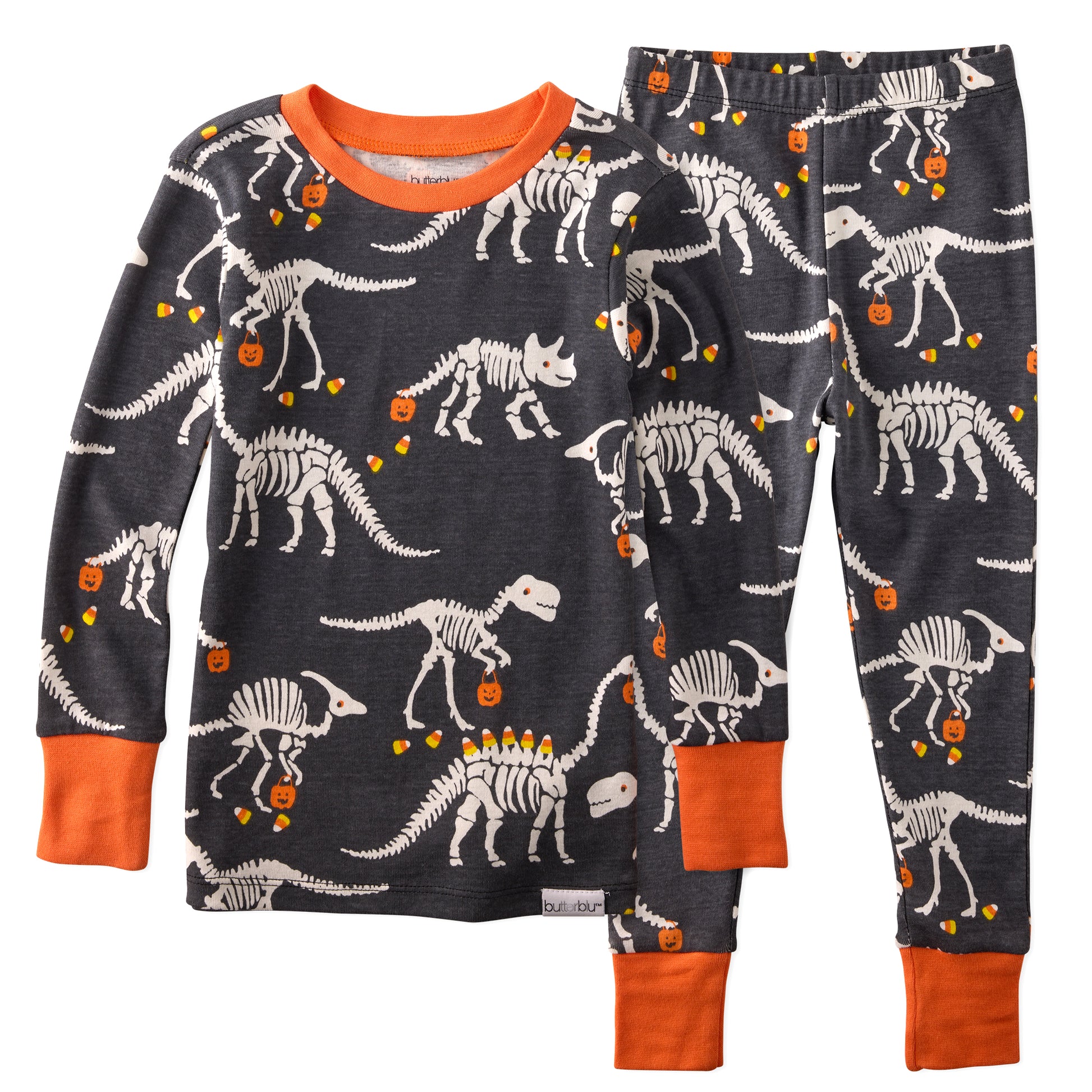 Children's pajama set with dinosaur skeleton pattern on a white background