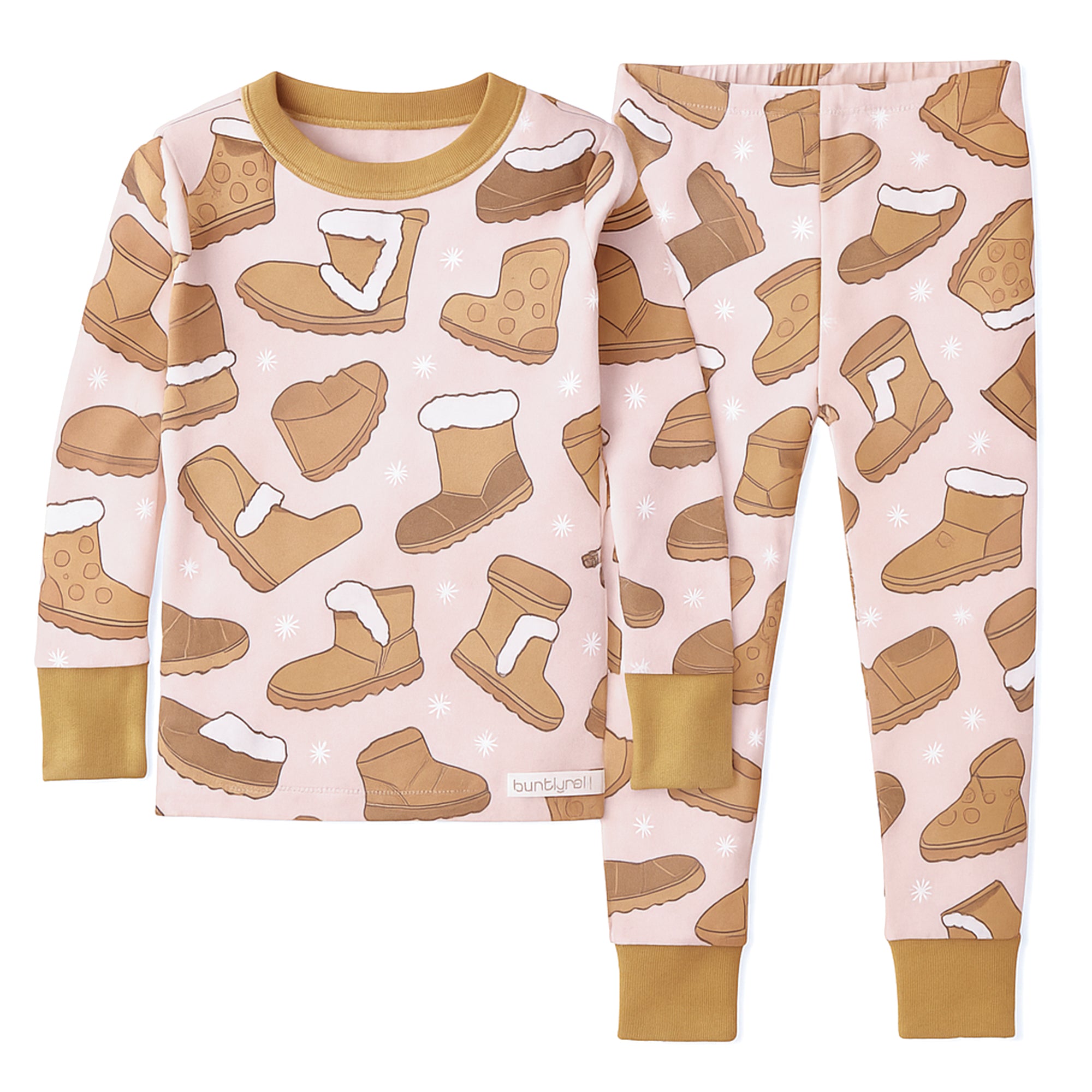 Children's pajama set with boot pattern on a pink background
