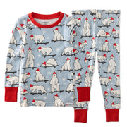 Children's pajama set with polar bear pattern on a blue background