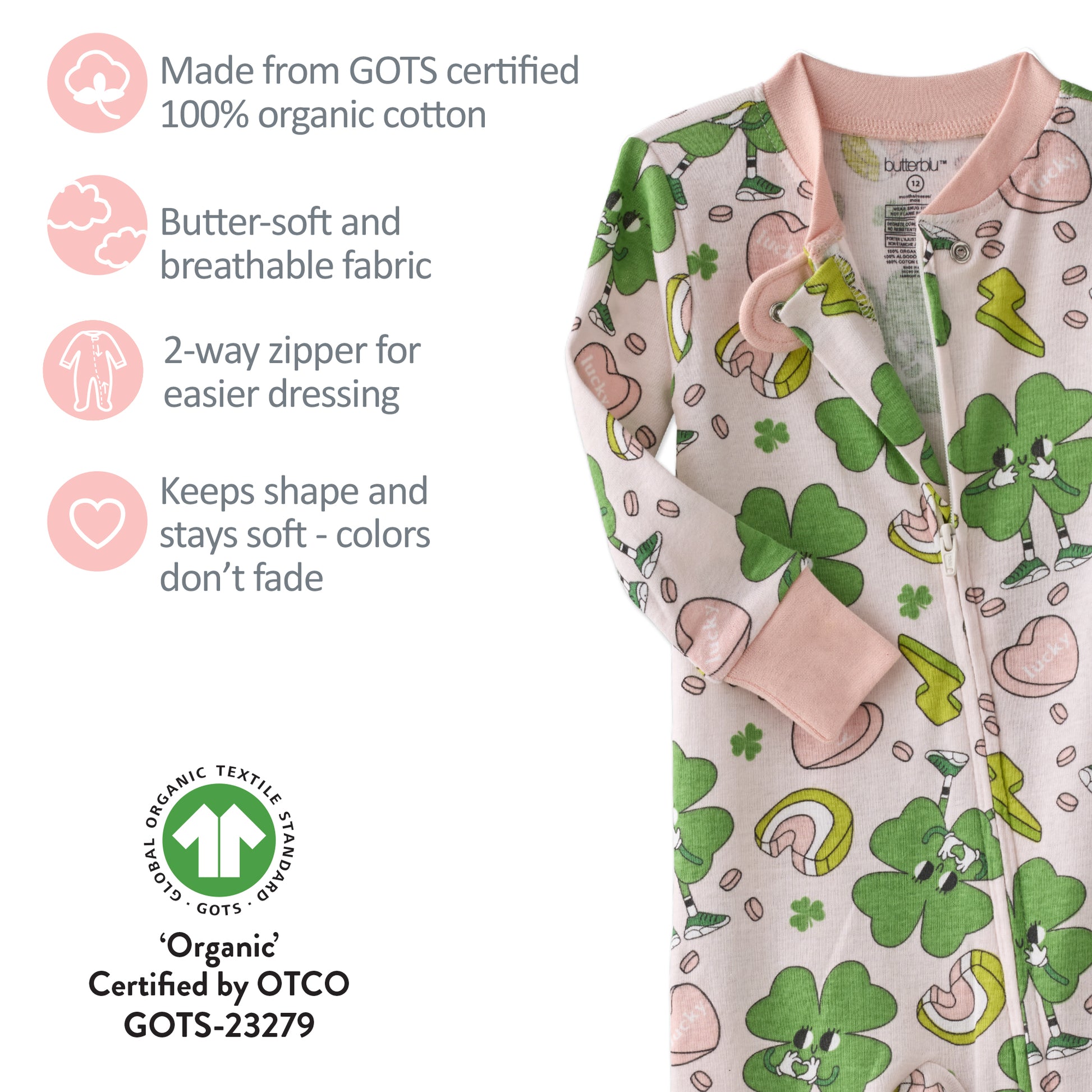 Baby onesie with green shamrock pattern and product features on a white background
