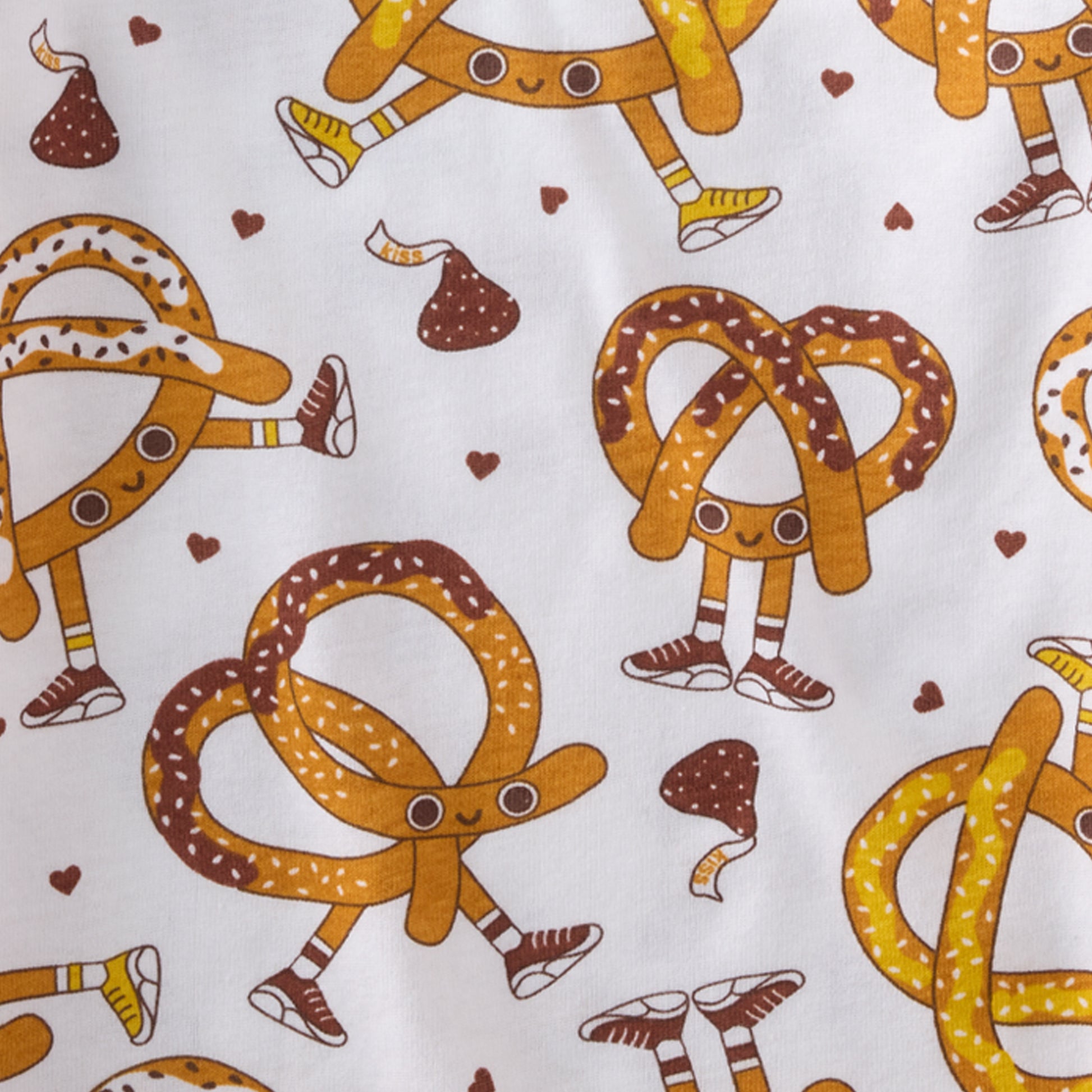 Pattern of cartoon pretzels with faces and legs on a white background