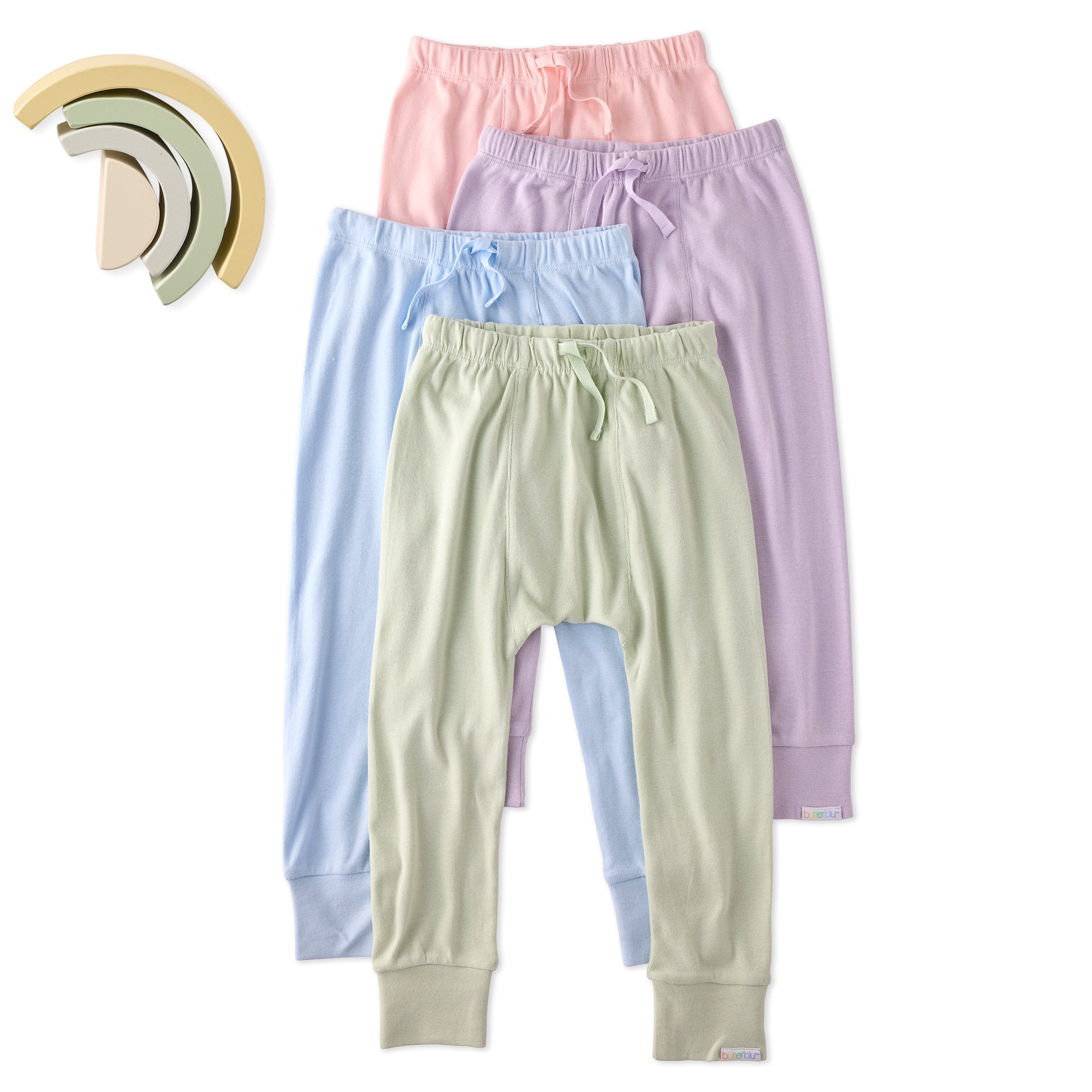 Set of pastel-colored children's pants on a white background