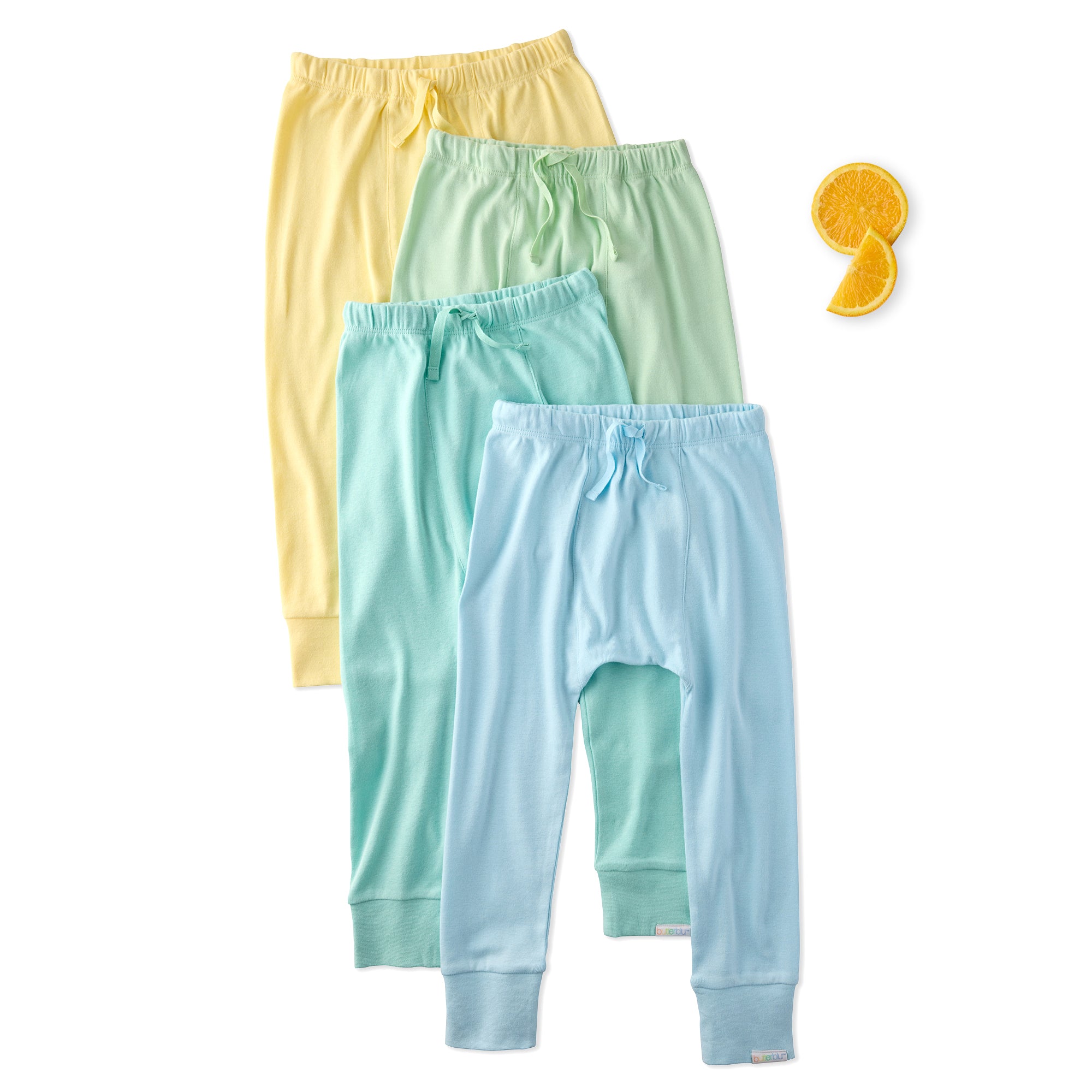 Three pairs of colorful baby pants on a white background